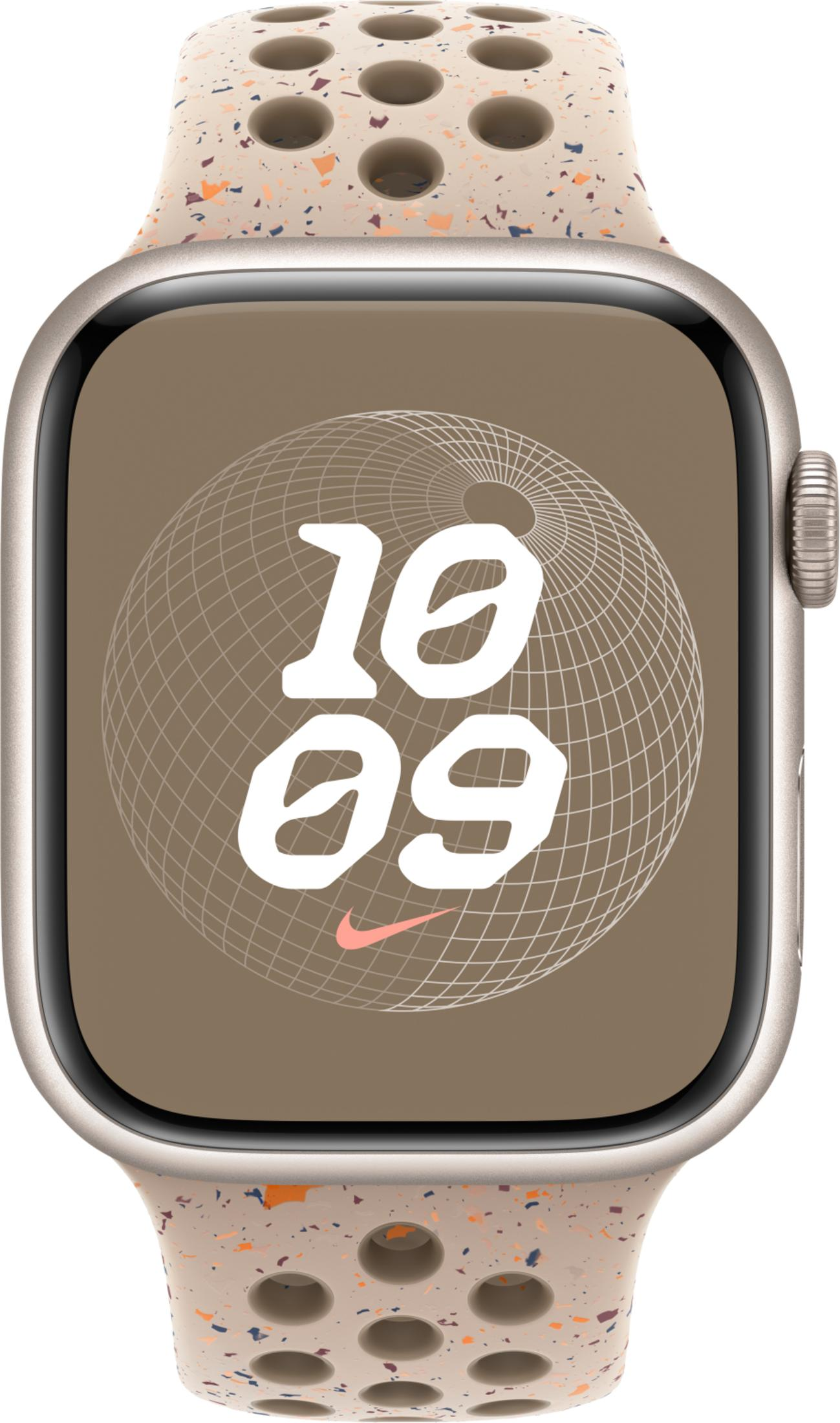 A smartwatch with a beige speckled band featuring perforations.
