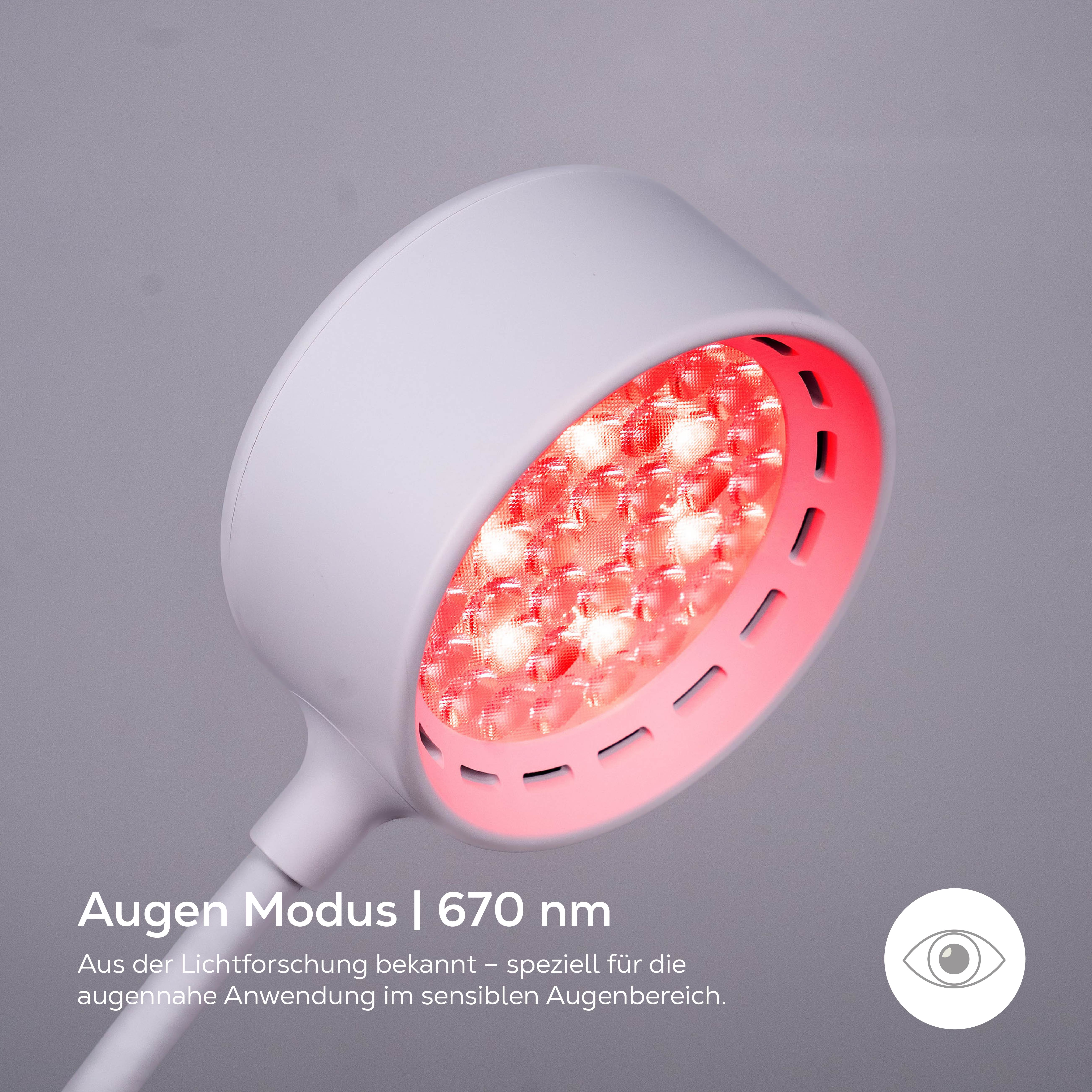 Ein weißes Gerät mit roten Lichtern, das für die Augenpartie bestimmt ist.