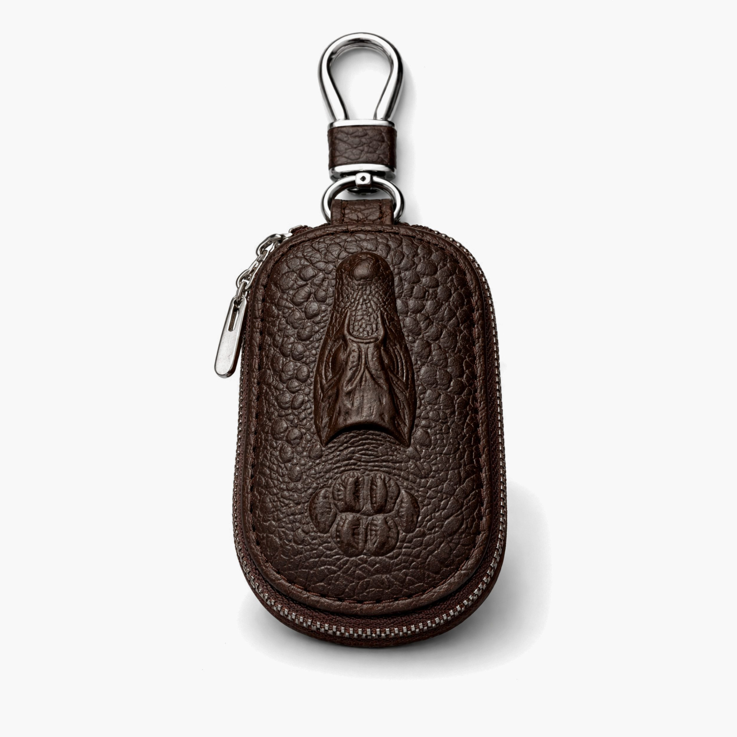 Braune Leder-Schlüsseltasche mit Krokodilprägung und silbernem Reißverschluss.