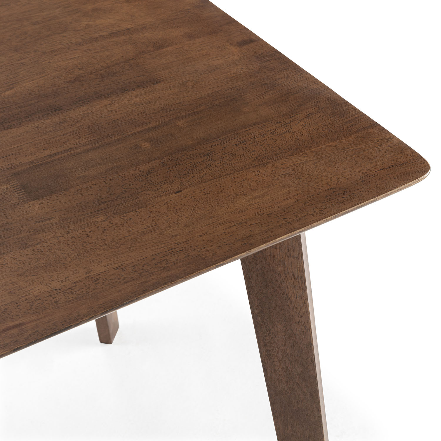 Un primer plano de la superficie de madera marrón de una mesa con una pata.