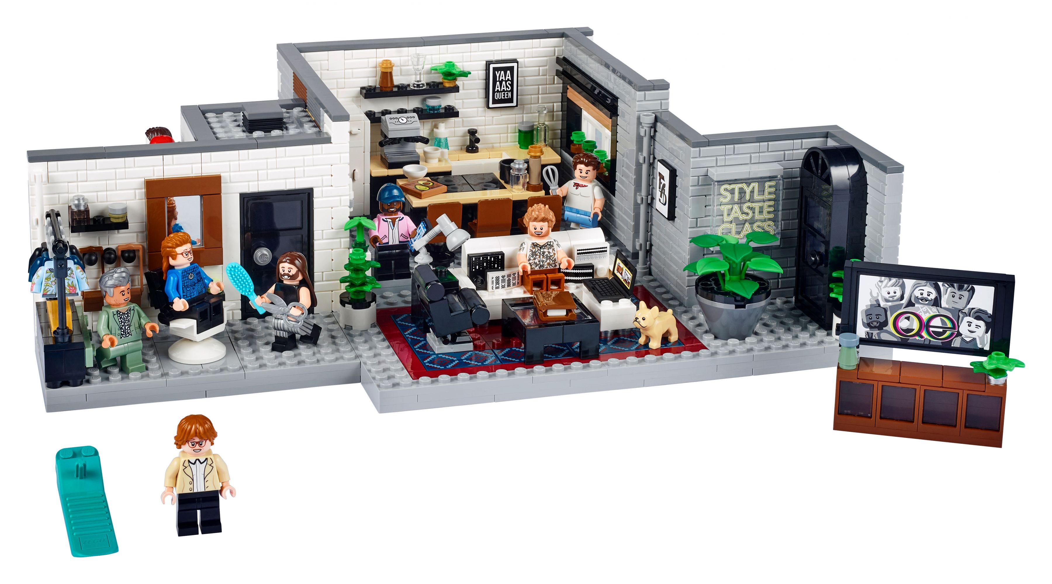 Lego-Modell eines Salons mit Figuren, Küche und Fernseher.