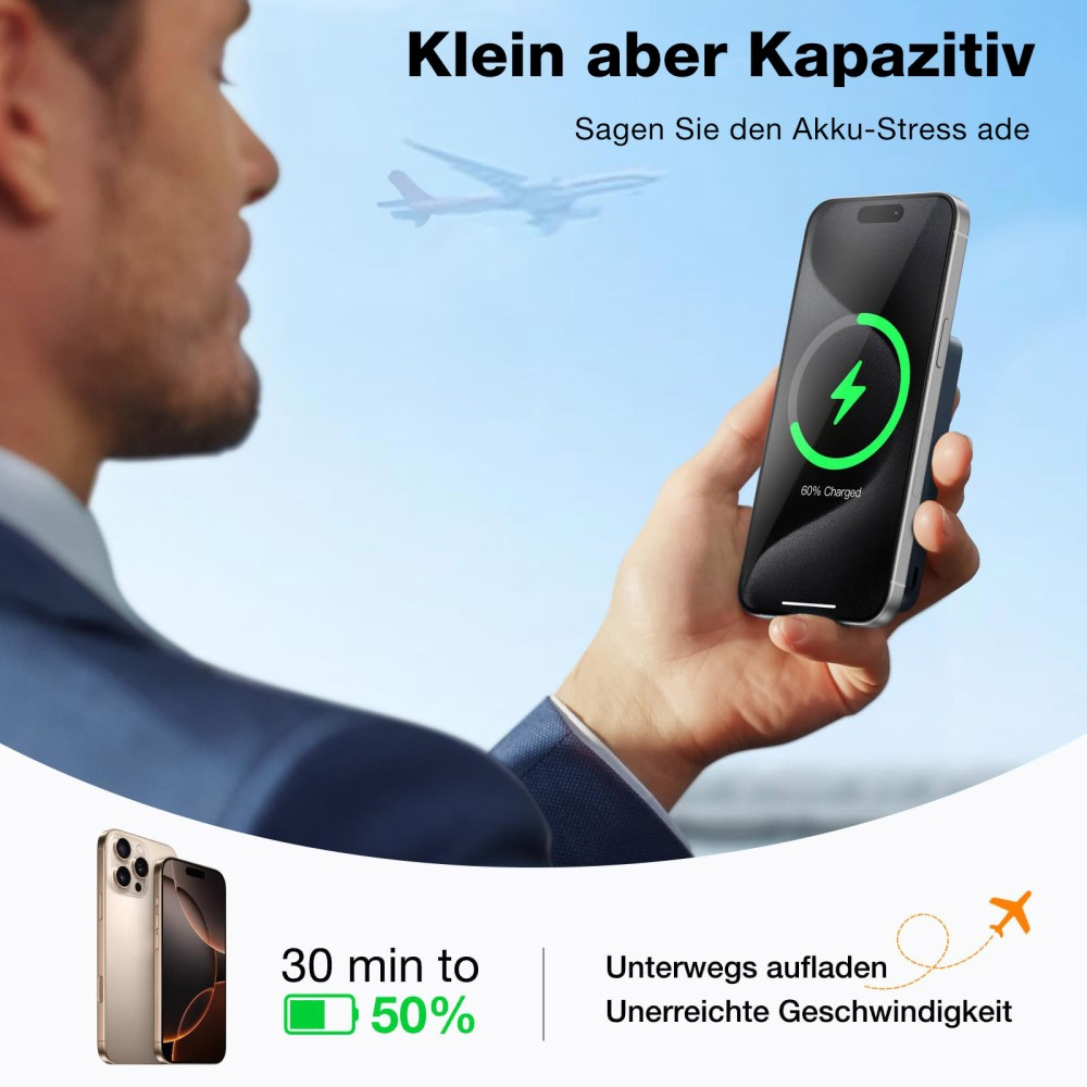Homme tenant un téléphone en charge. Avion en arrière-plan.