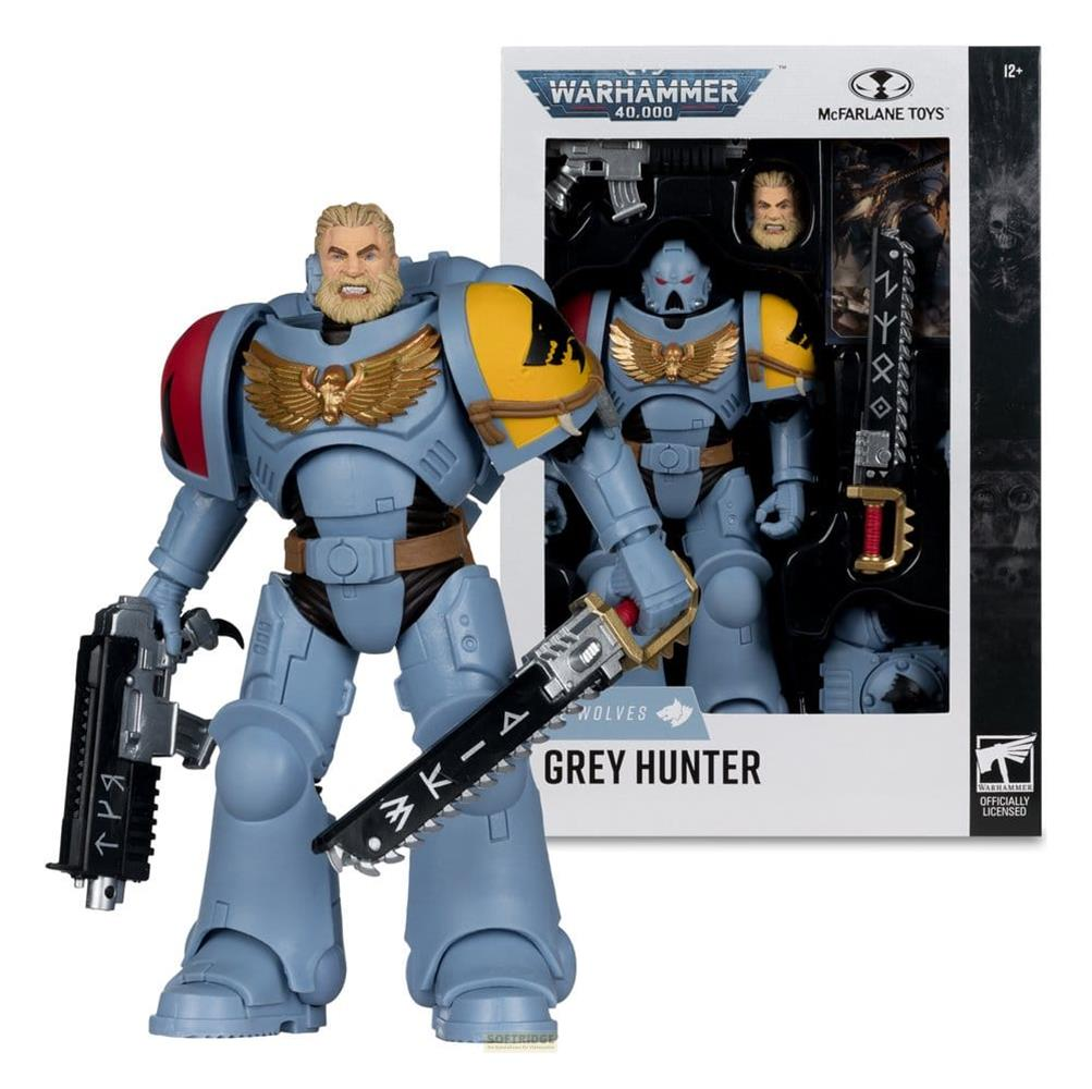 Ein grauer Space Marine mit Kettenschwert und Bolter, im Karton.