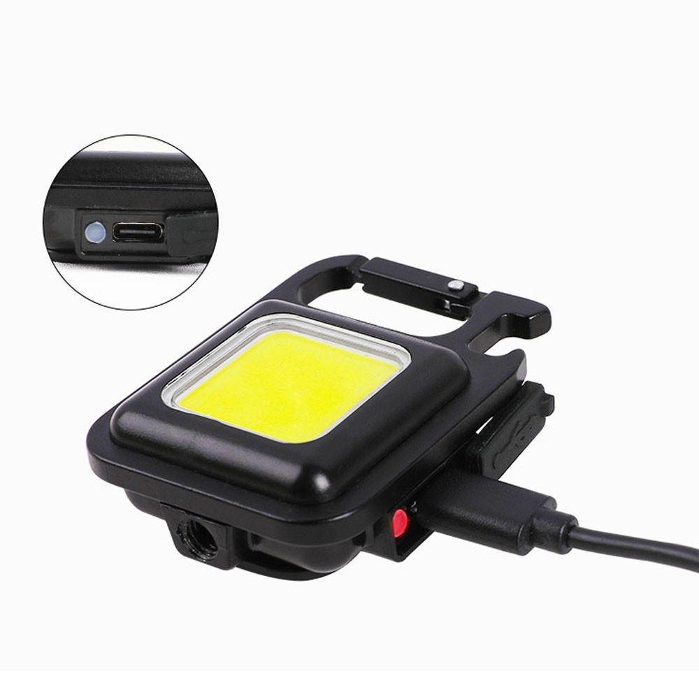 Schwarze COB-Taschenlampe mit Karabiner, USB-C-Anschluss und Ladeanzeige.
