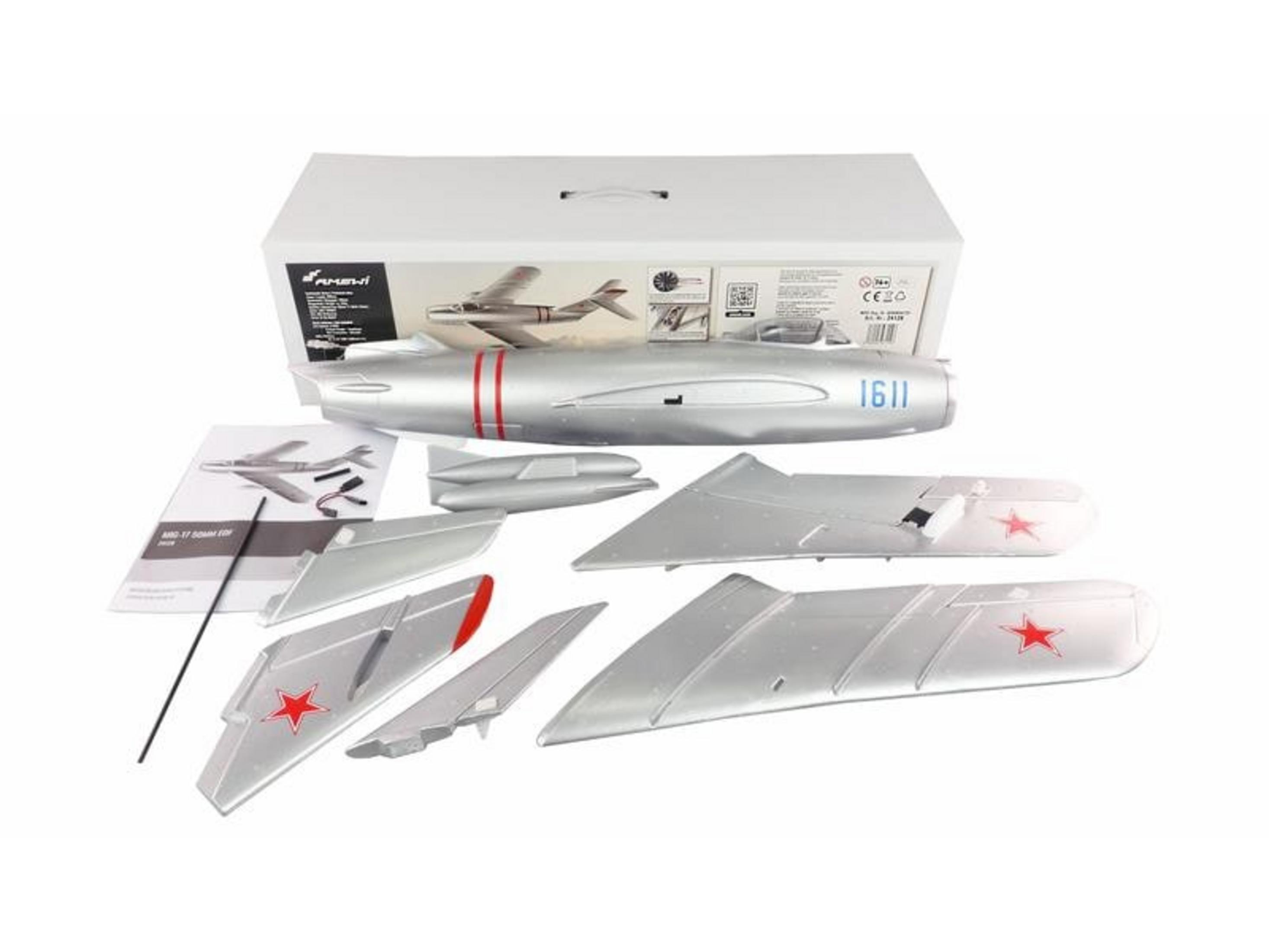 Maquette d'avion argentée démontée, avec étoiles rouges et instructions.