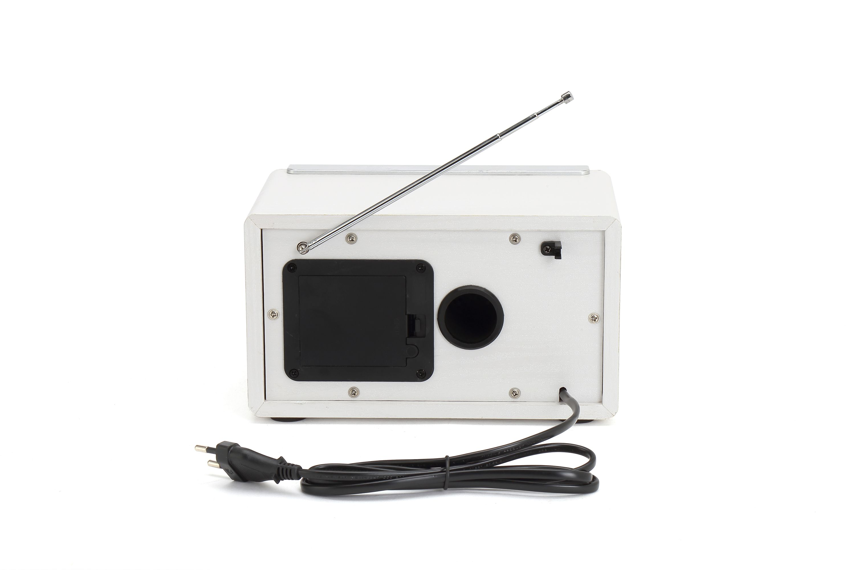 Back of a white radio with antenna extended and power cord plugged in.