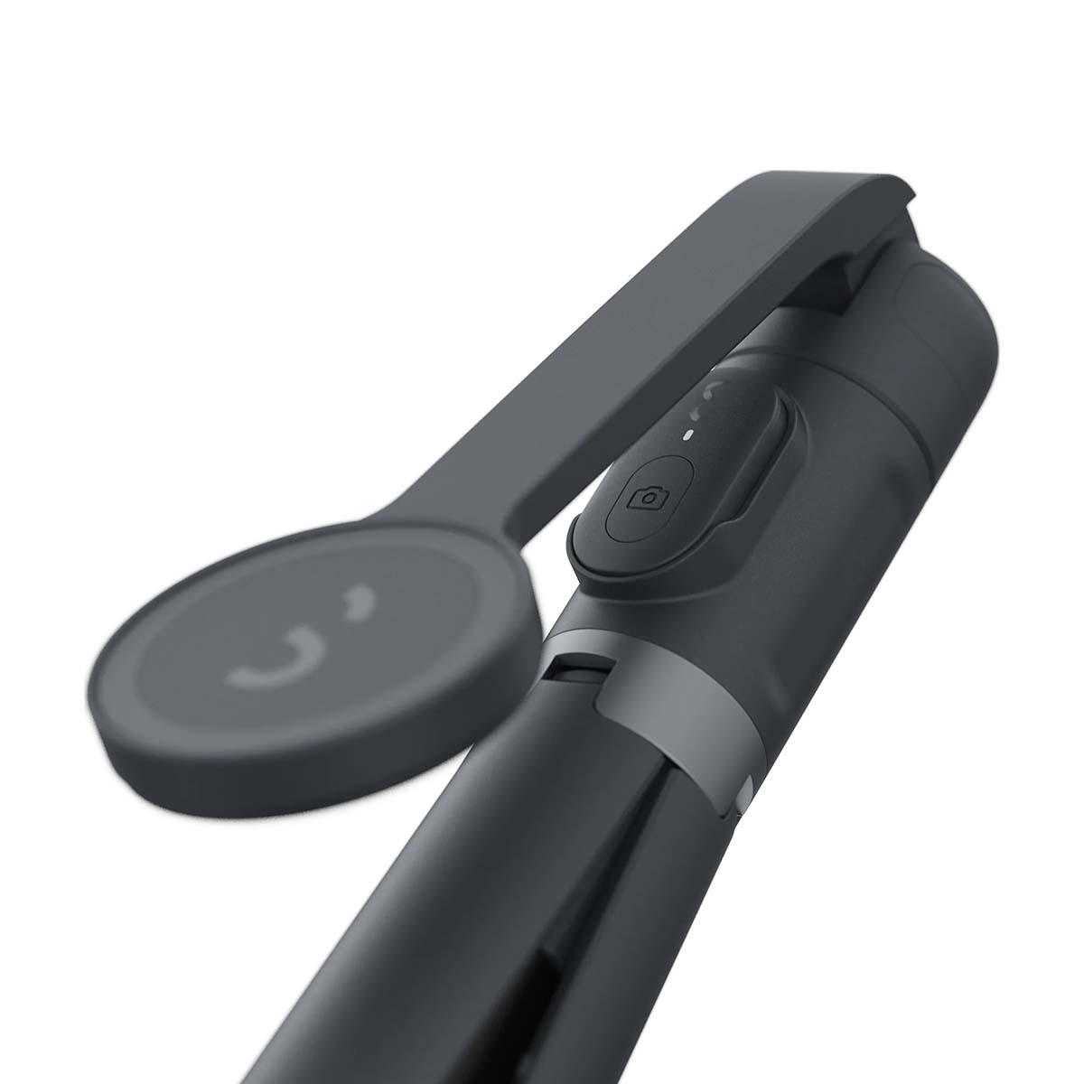 Ein dunkelgrauer Selfie-Stick mit Kamerataste und rundem Handyhalter.