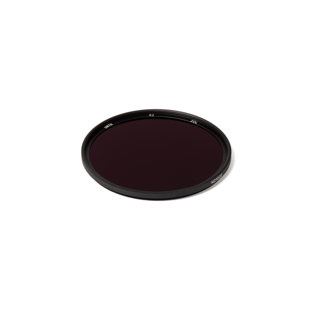 Een rond, donker ND1000-filter met tekst op witte achtergrond.