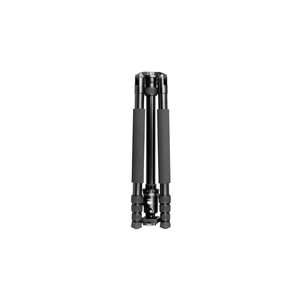 A folded black camera tripod with black foam grips.