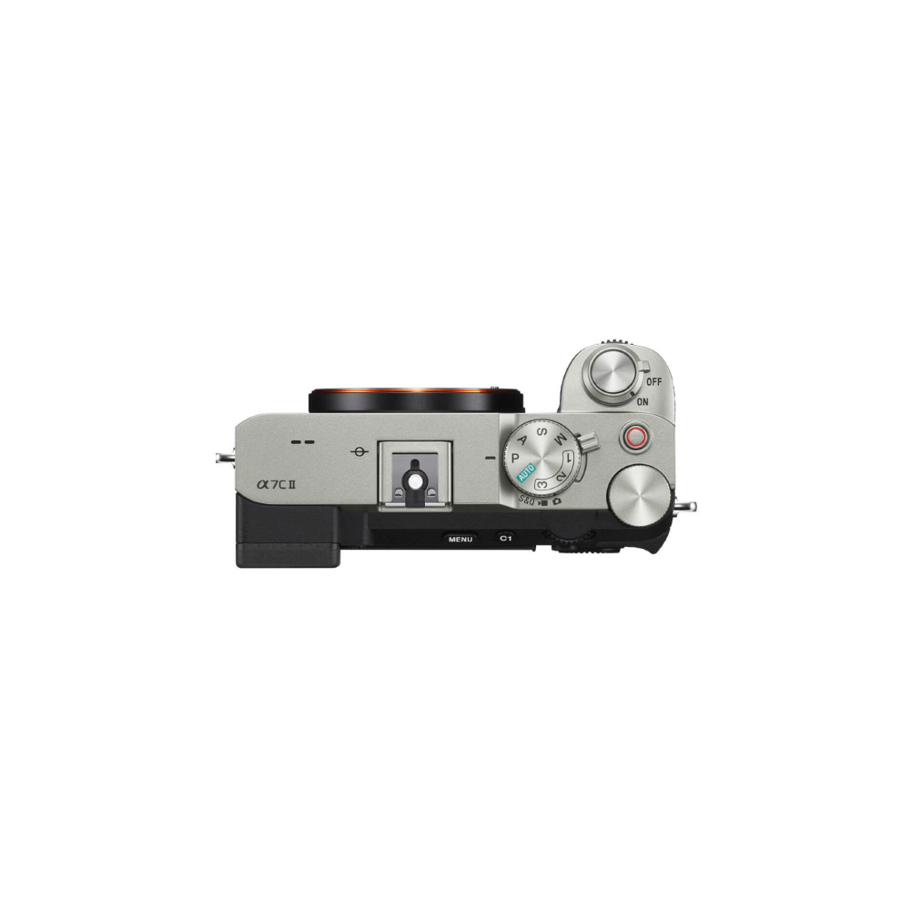 A silver Sony Alpha 7C II camera seen from above, focusing on the mode dial.