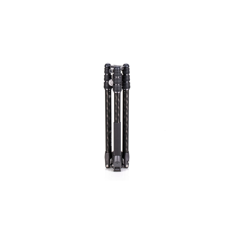 A folded black carbon fiber tripod with silver clasps on a white background.