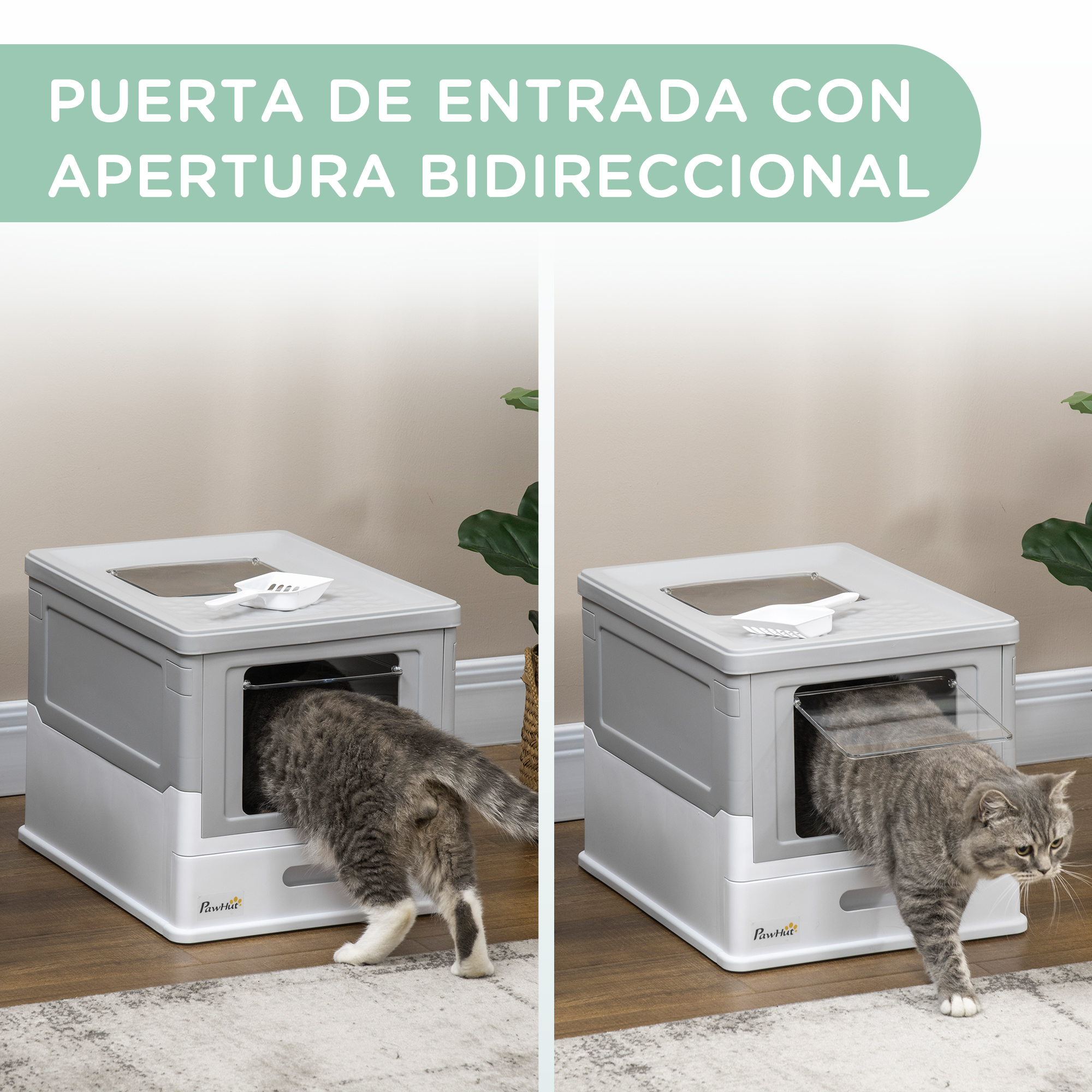 Un gato entra en una caja de arena gris y blanca, otro sale. Una pala descansa encima.
