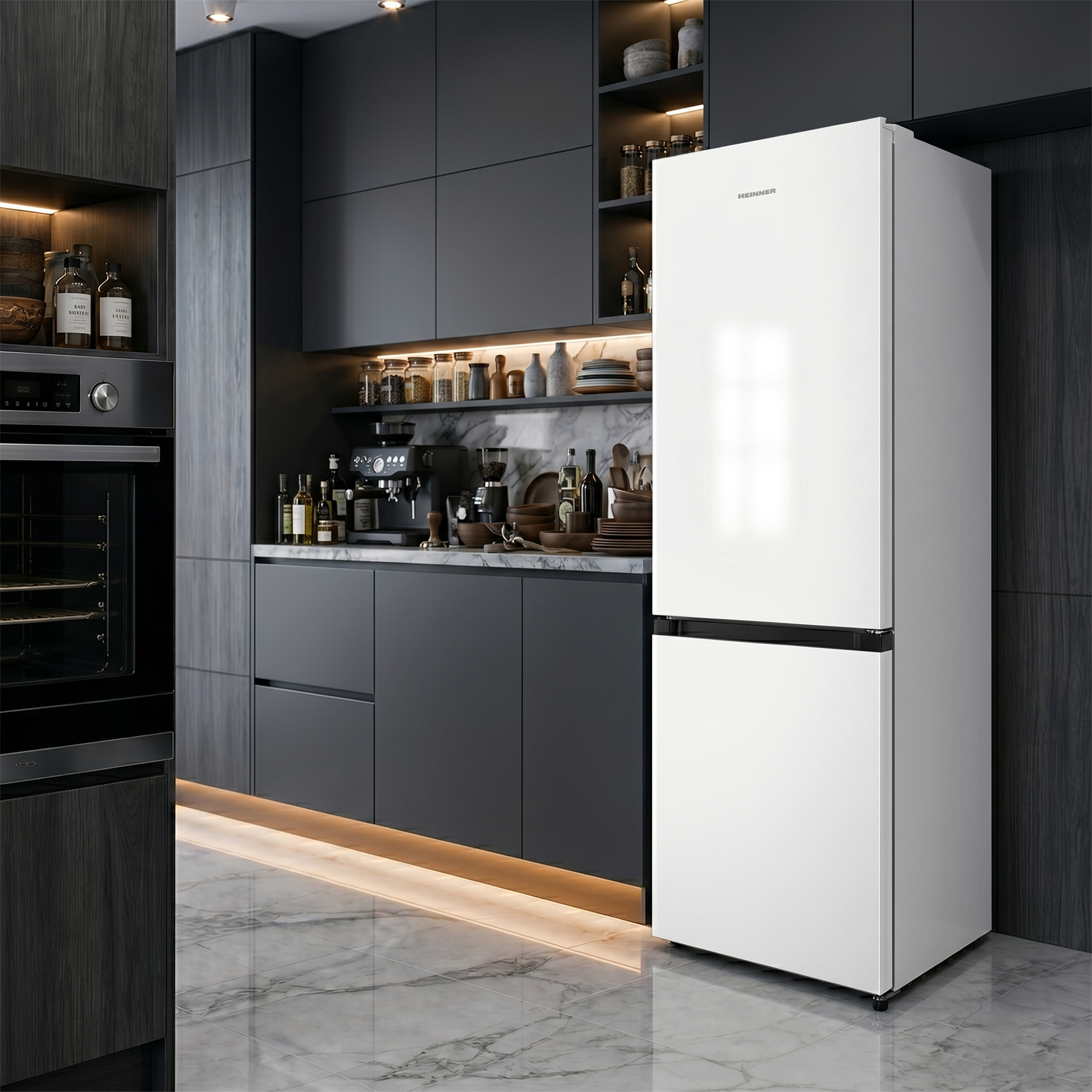 Modern kitchen with white fridge, dark cabinets, built-in oven, and marble floor.