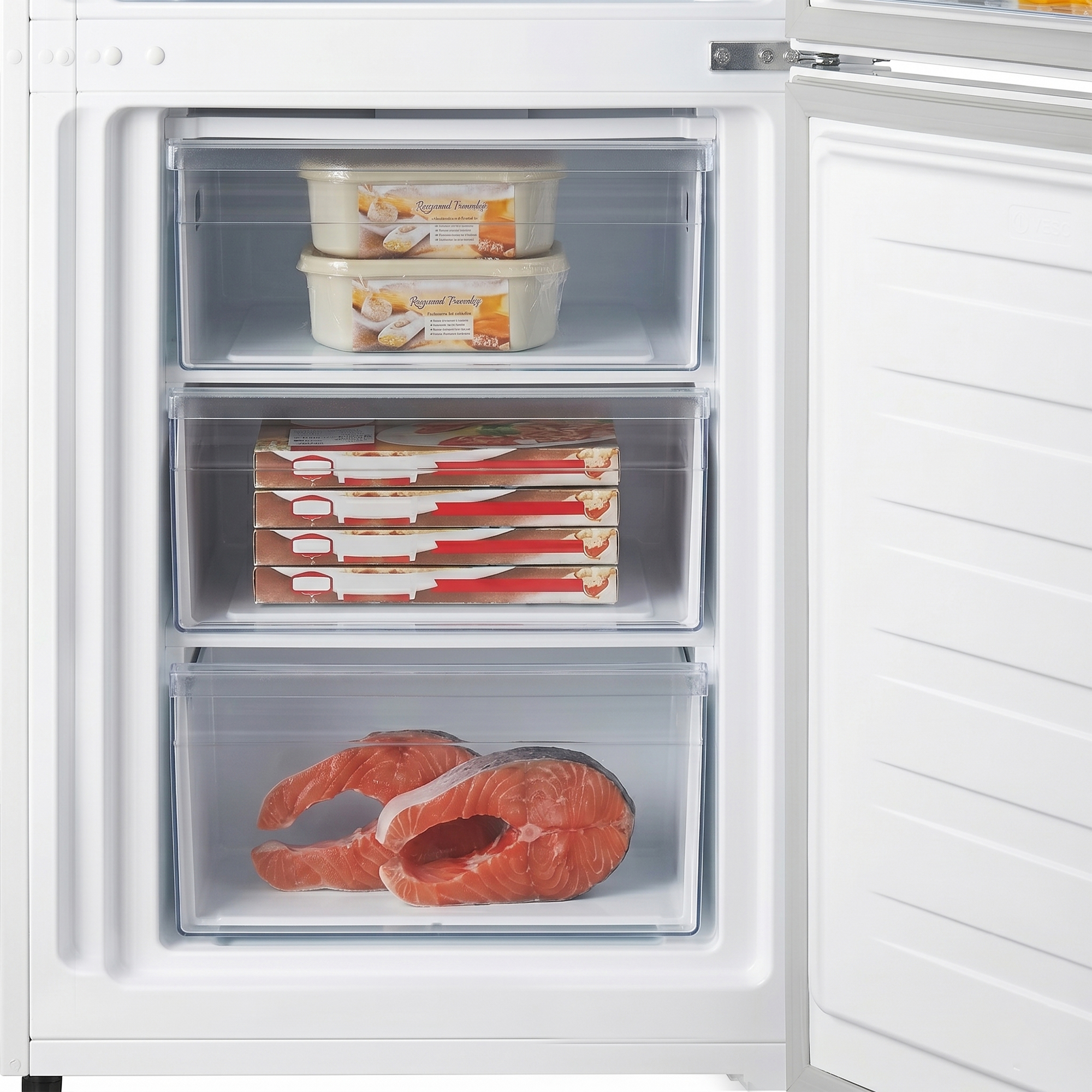 An open freezer with three drawers: two containers on top, four pizza boxes in the middle, two salmon steaks below.