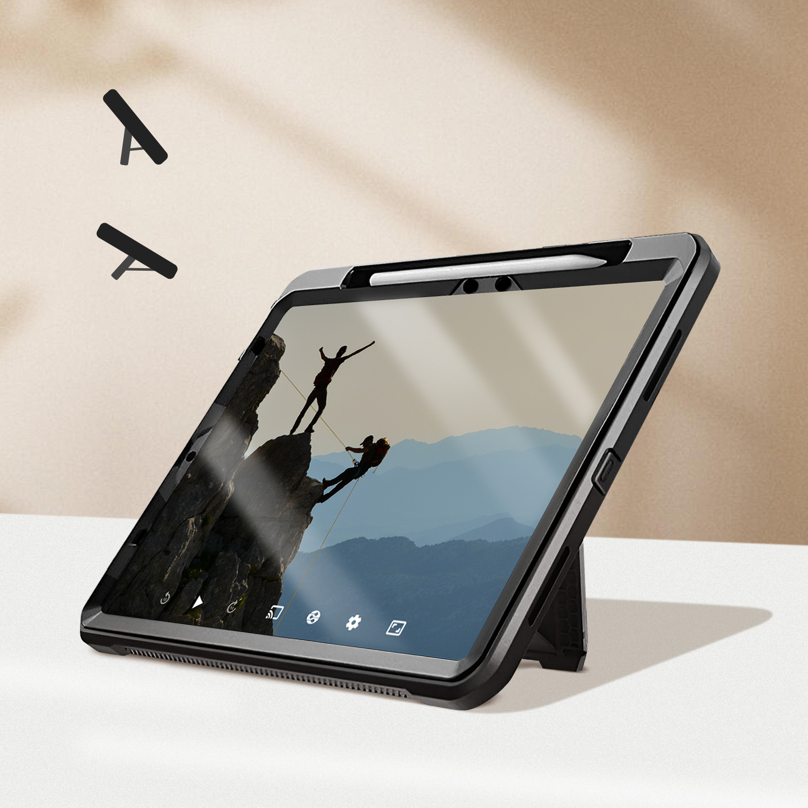 Tablet mit Ständer zeigt Kletterer auf felsiger Spitze. Zwei schwarze Ständer schweben darüber.