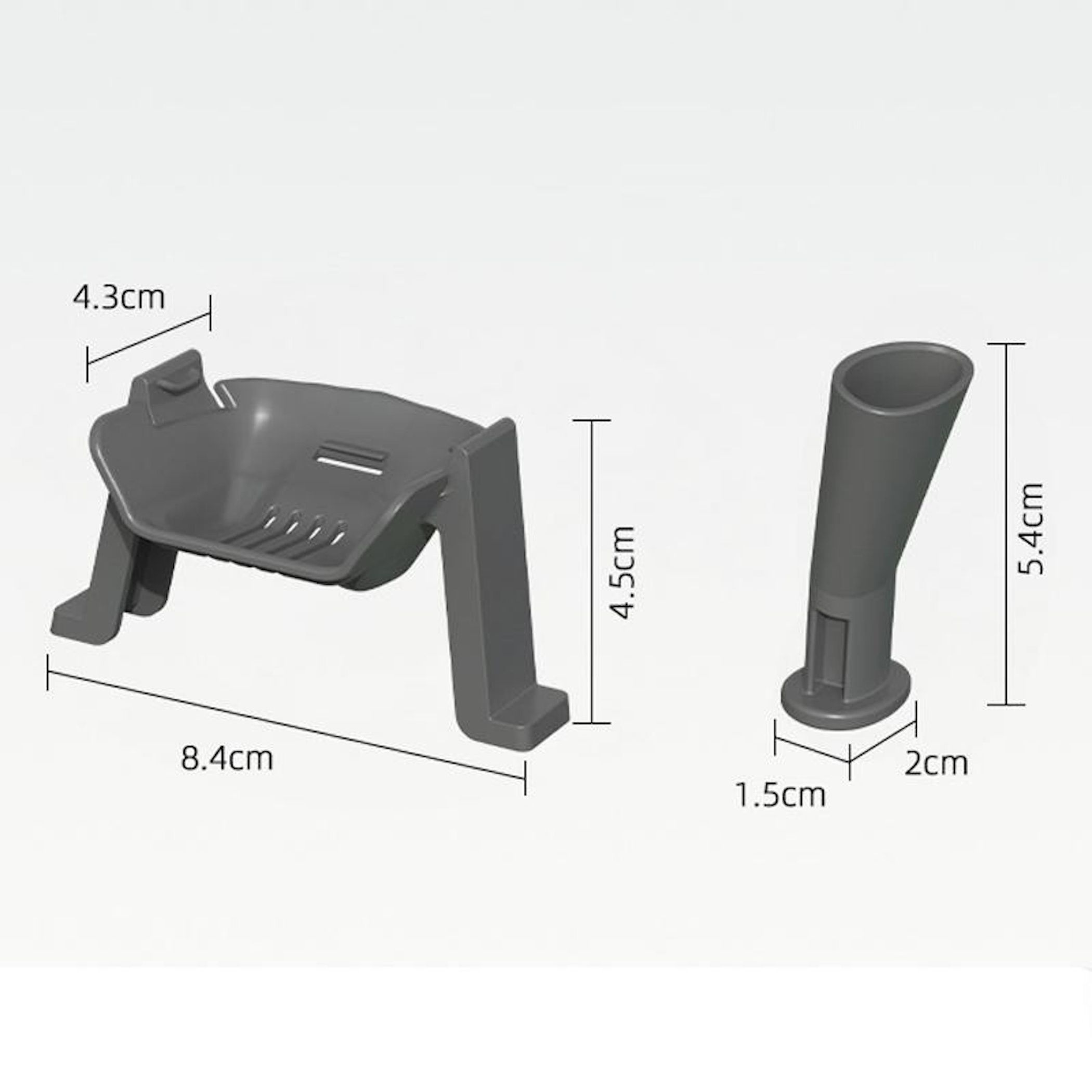 Grauer Seifenhalter (8,4x4,3cm) und ein Rohr (5,4x1,5cm).
