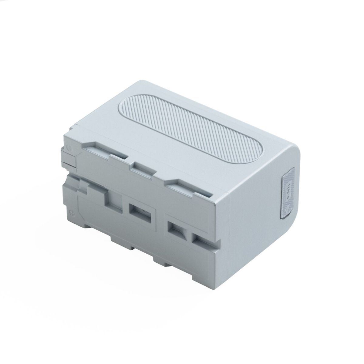 Batteria grigia con parte superiore scanalata e fessure laterali.