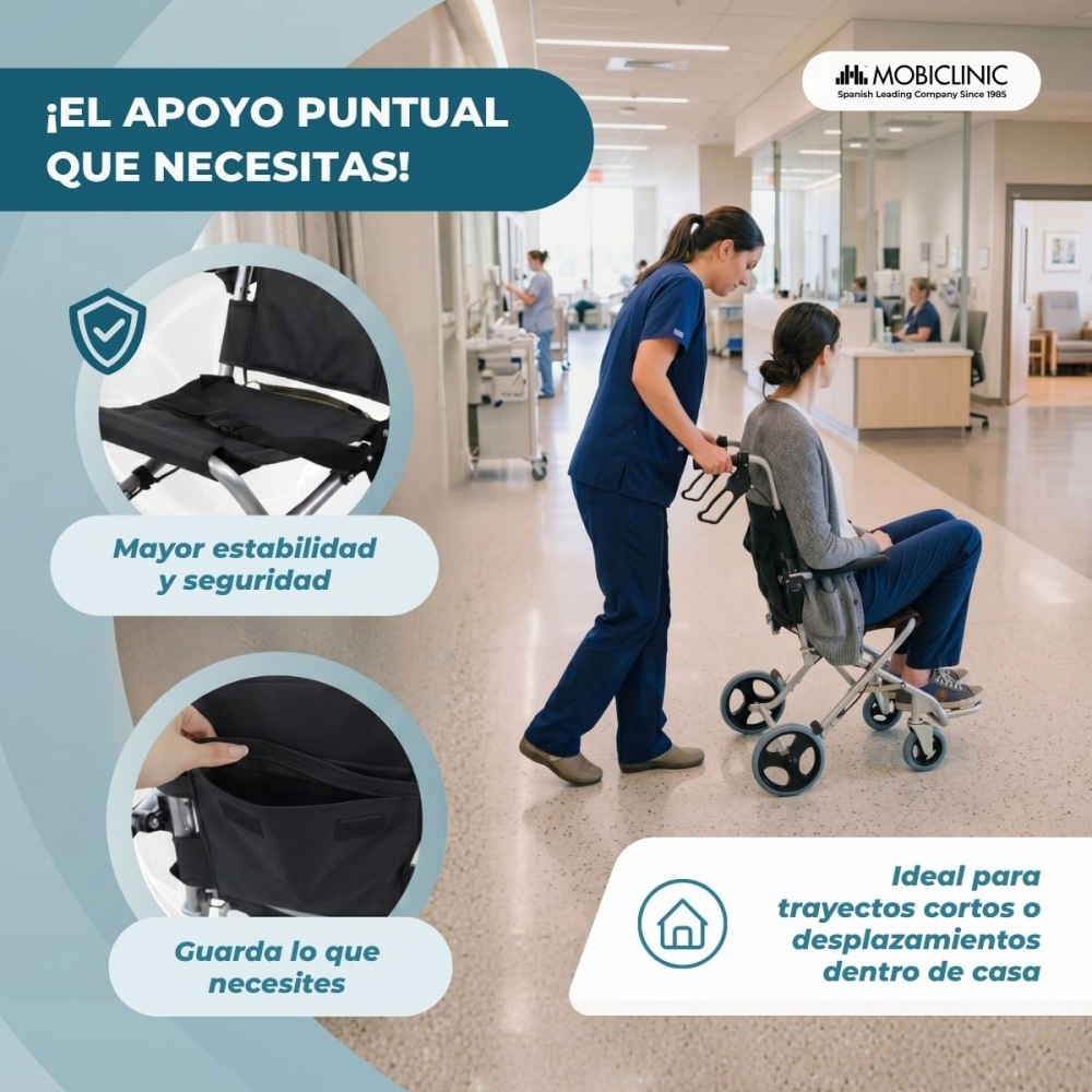 Una enfermera empuja a una paciente en silla de ruedas por un pasillo de hospital.