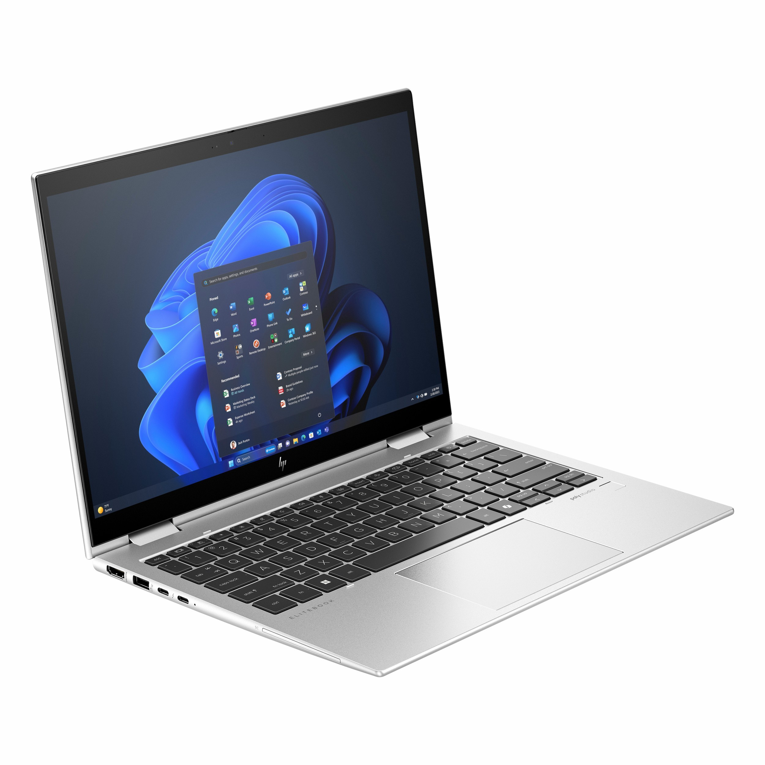 Ekranı açık, Windows 11 menüsü ve mavi dalgalı duvar kağıdı gösteren gümüş renkli bir dizüstü bilgisayar.