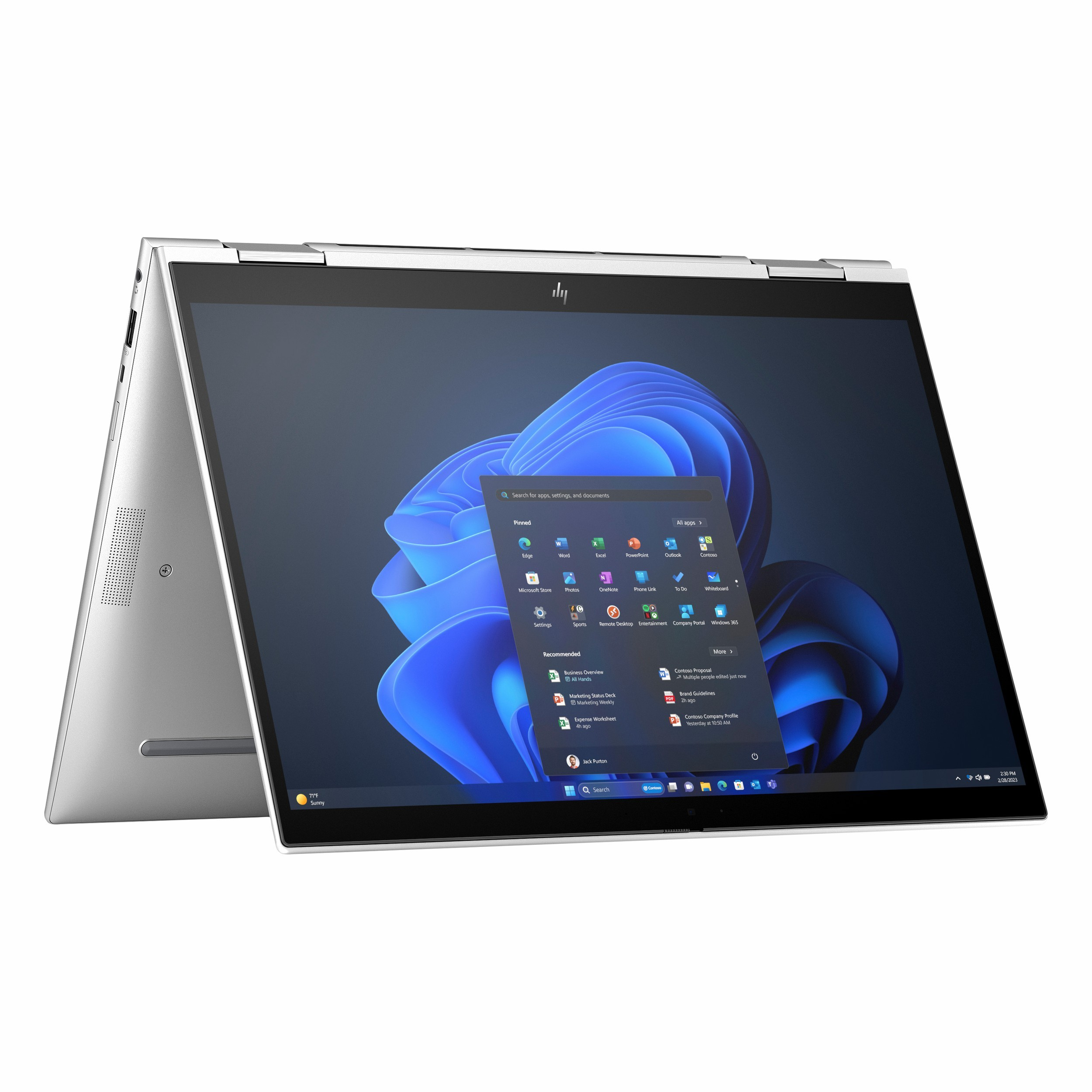 Ekranı açık, Windows 11 ve uygulamaları gösteren gümüş rengi bir dizüstü bilgisayar.