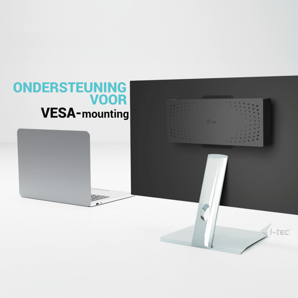 A laptop sits left of a monitor mounted on a stand.