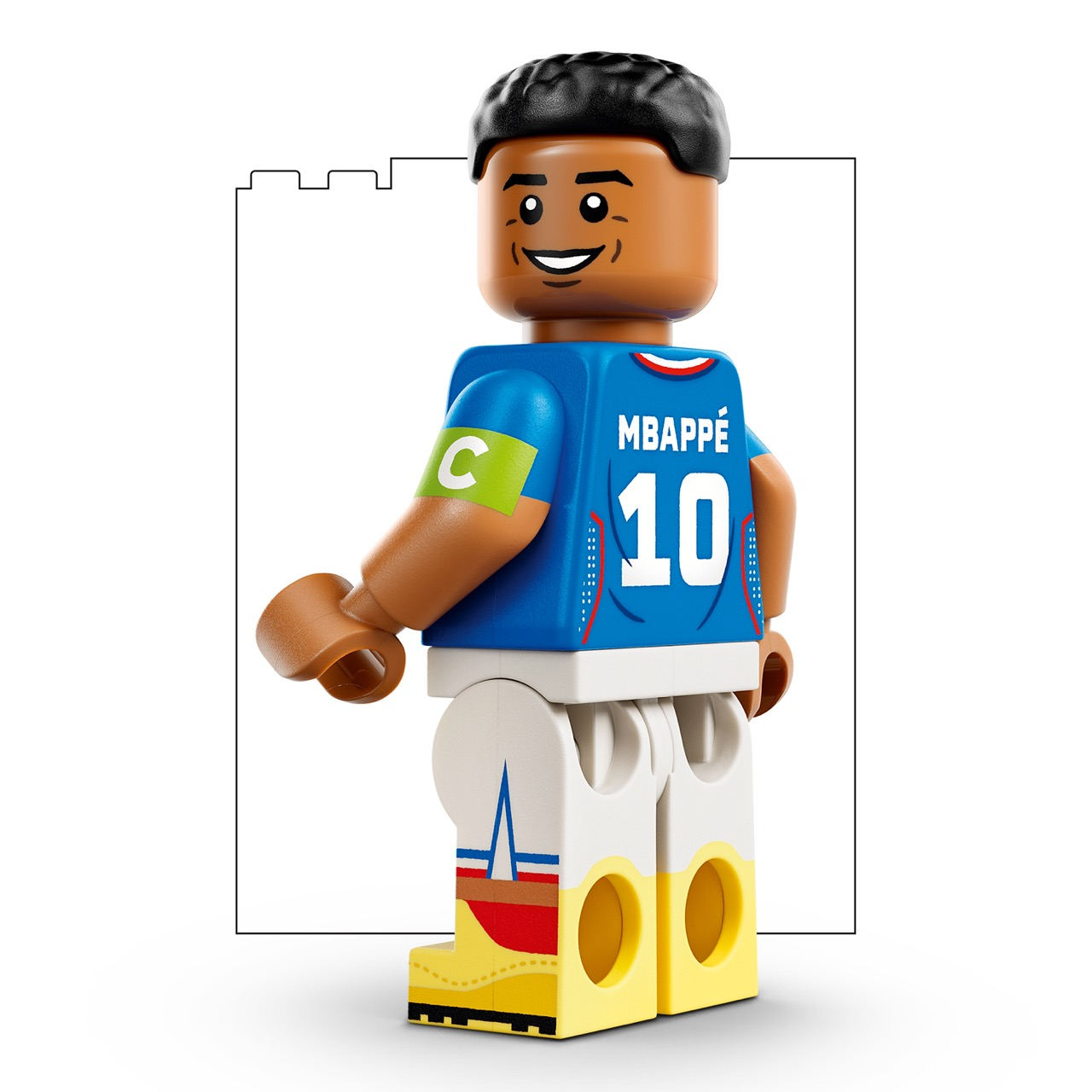 Mavi forma, 10 numaralı, beyaz şortlu ve sarı ayakkabılı Lego futbol figürü.