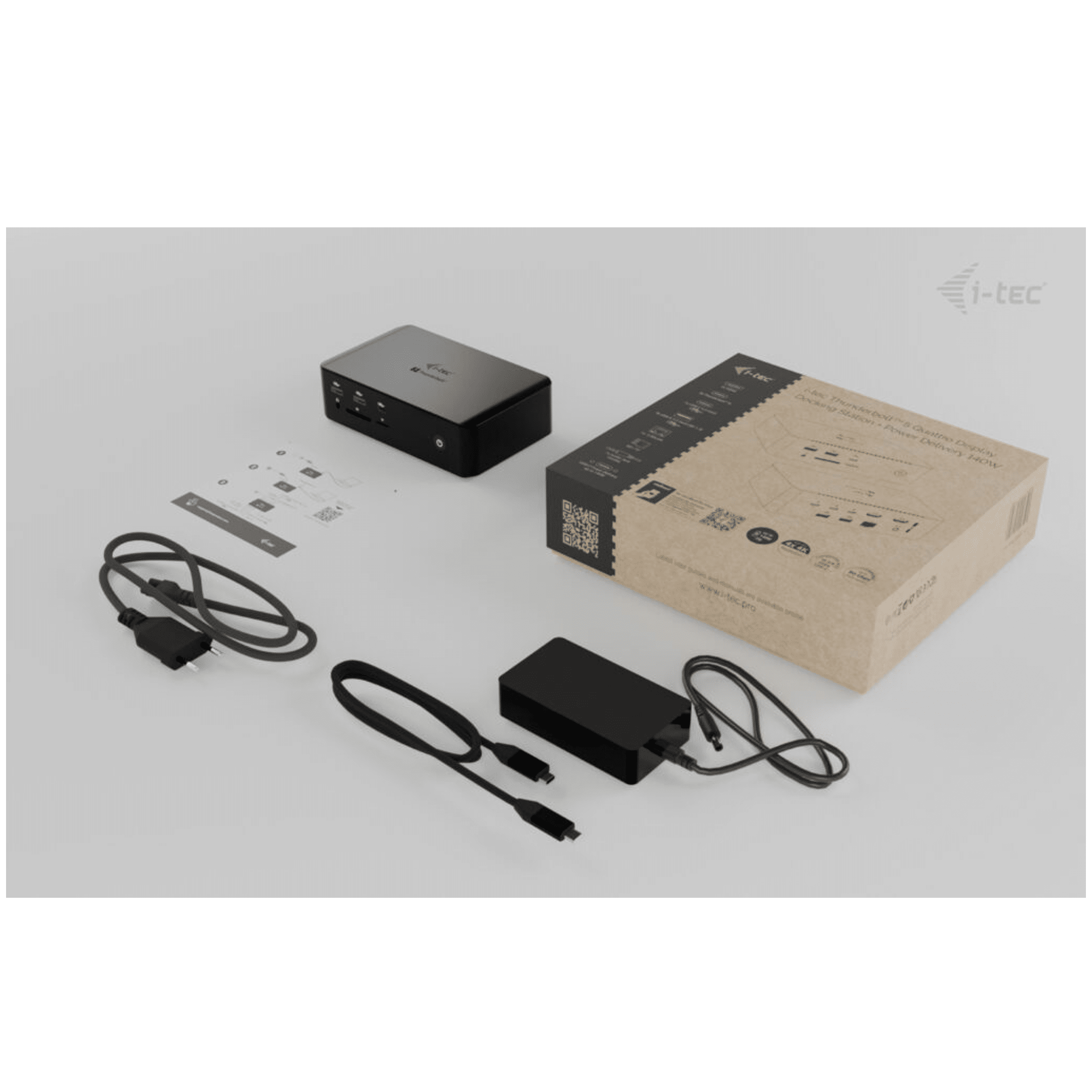 Black docking station adapter with cables and packaging.