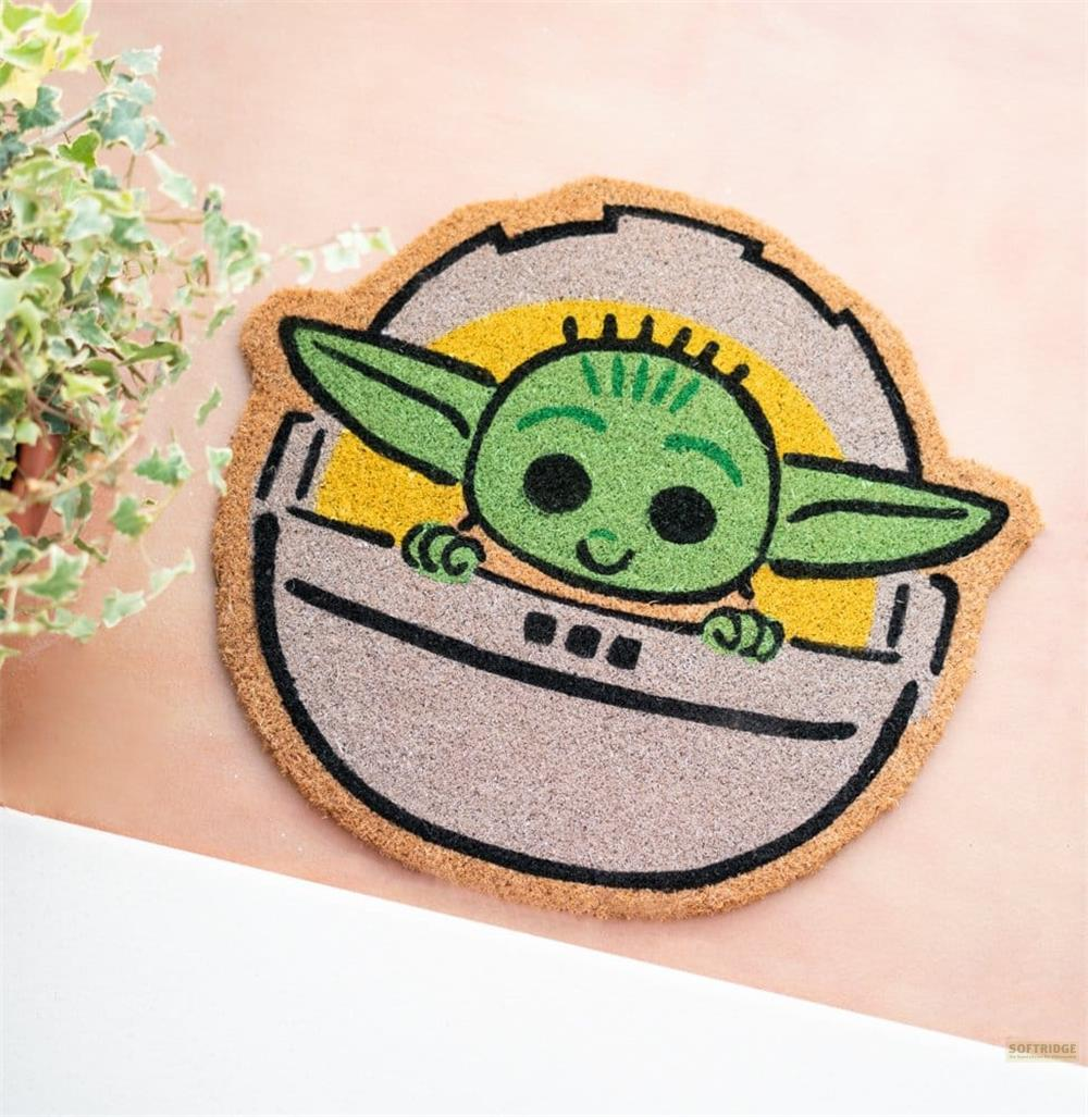 Un simpatico cartone animato di Grogu di Star Wars che spunta da un baccello grigio con accenti gialli.