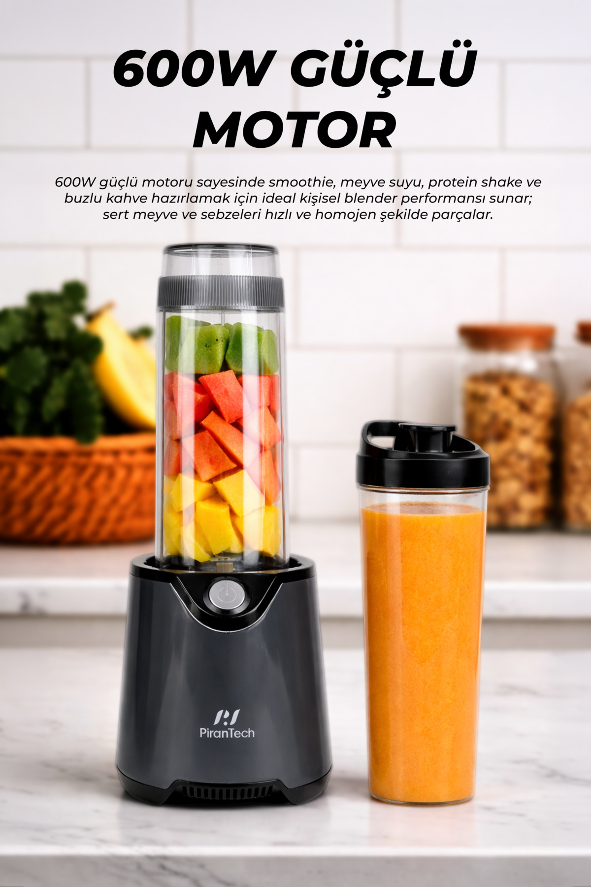 Gray blender with fruit pieces and a finished smoothie beside it.