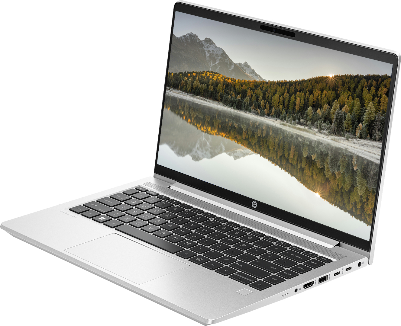 Gümüş HP ProBook dizüstü bilgisayar açık, klavye ve dağ gölü manzarası ekranda.
