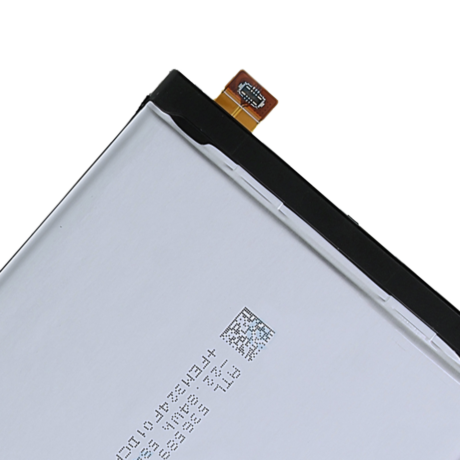 Una batteria bianca con bordo nero e un piccolo cavo piatto.