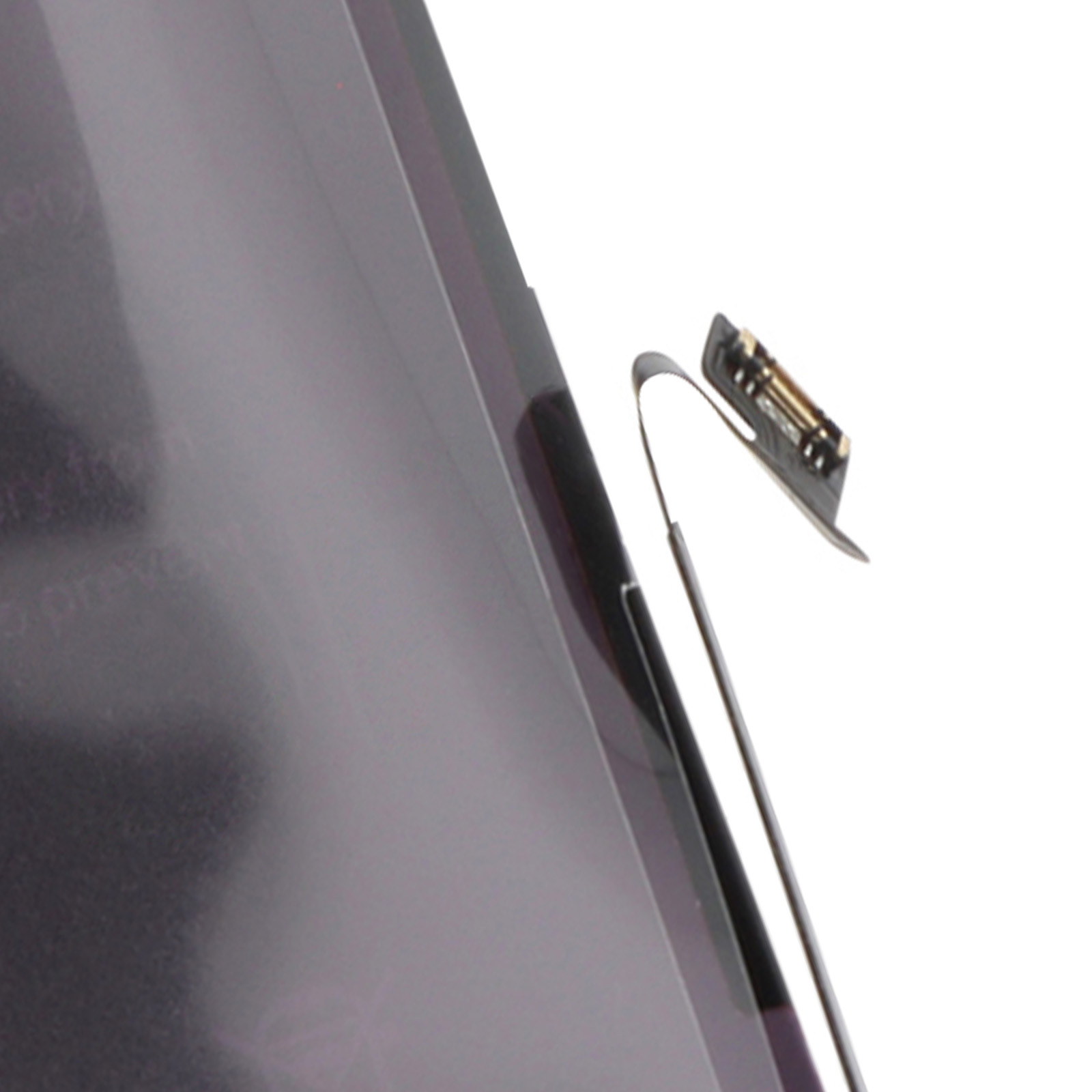 Un sottile cavo metallico con connettore nero su uno schermo grigio inclinato.