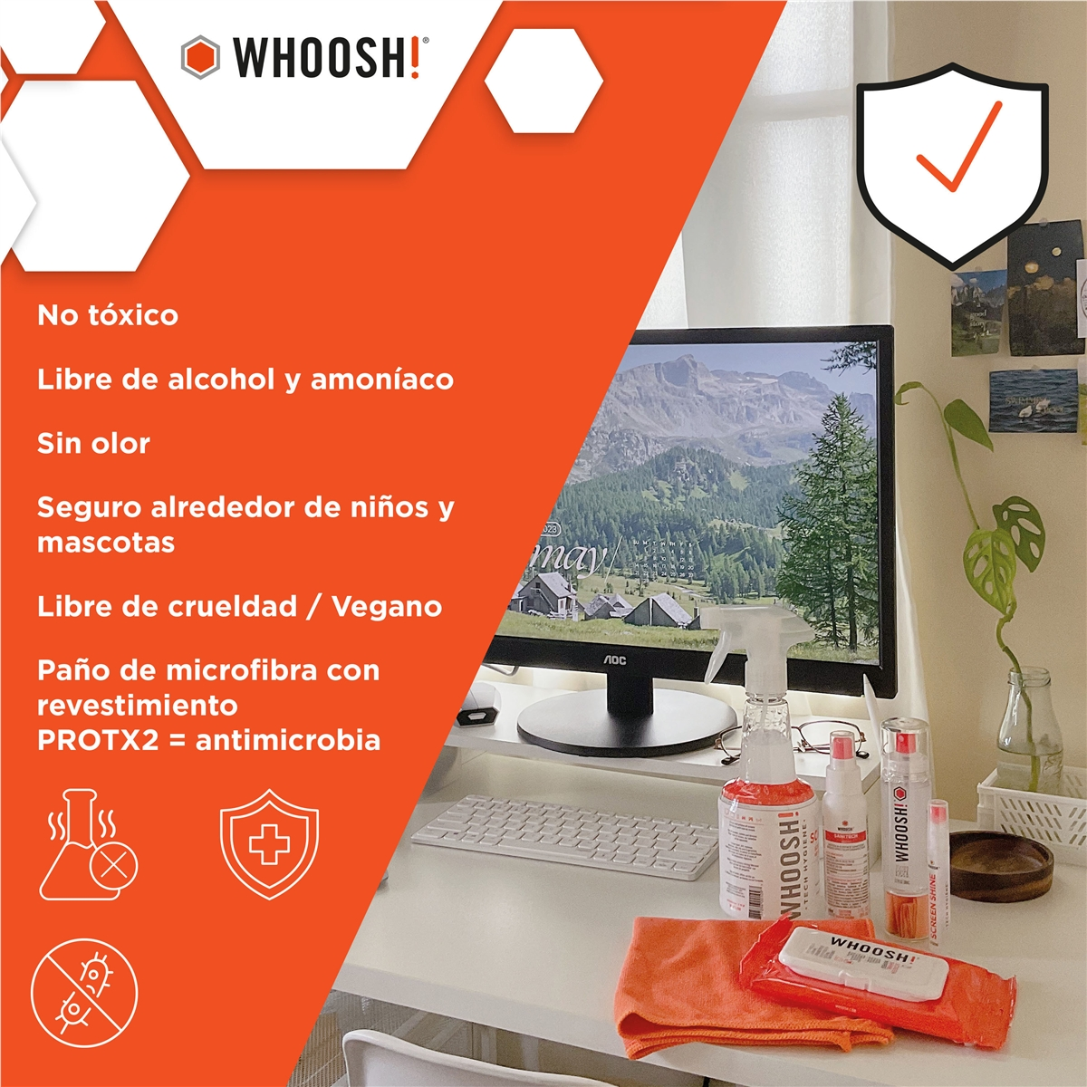 Desk with computer monitor, keyboard, cleaning products, and microfiber cloth.