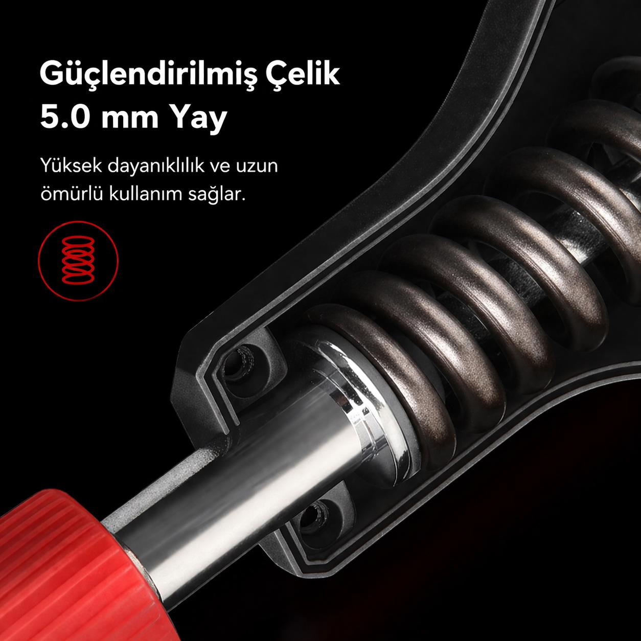 Kırmızı tutamaklı çelik yay, mekanizmanın yakından görünümü.