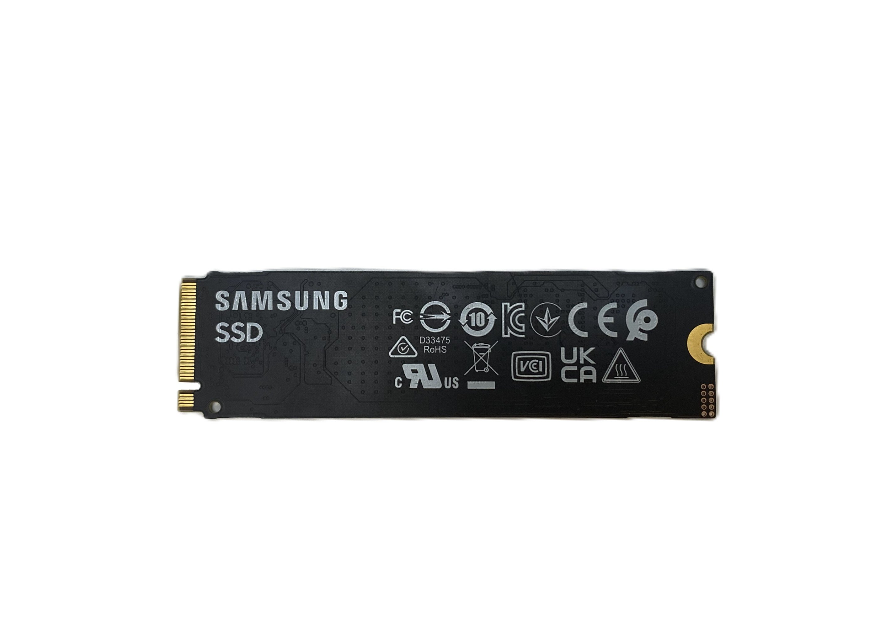 Czarny dysk SSD Samsung ze złotymi stykami i różnymi logo certyfikacji.