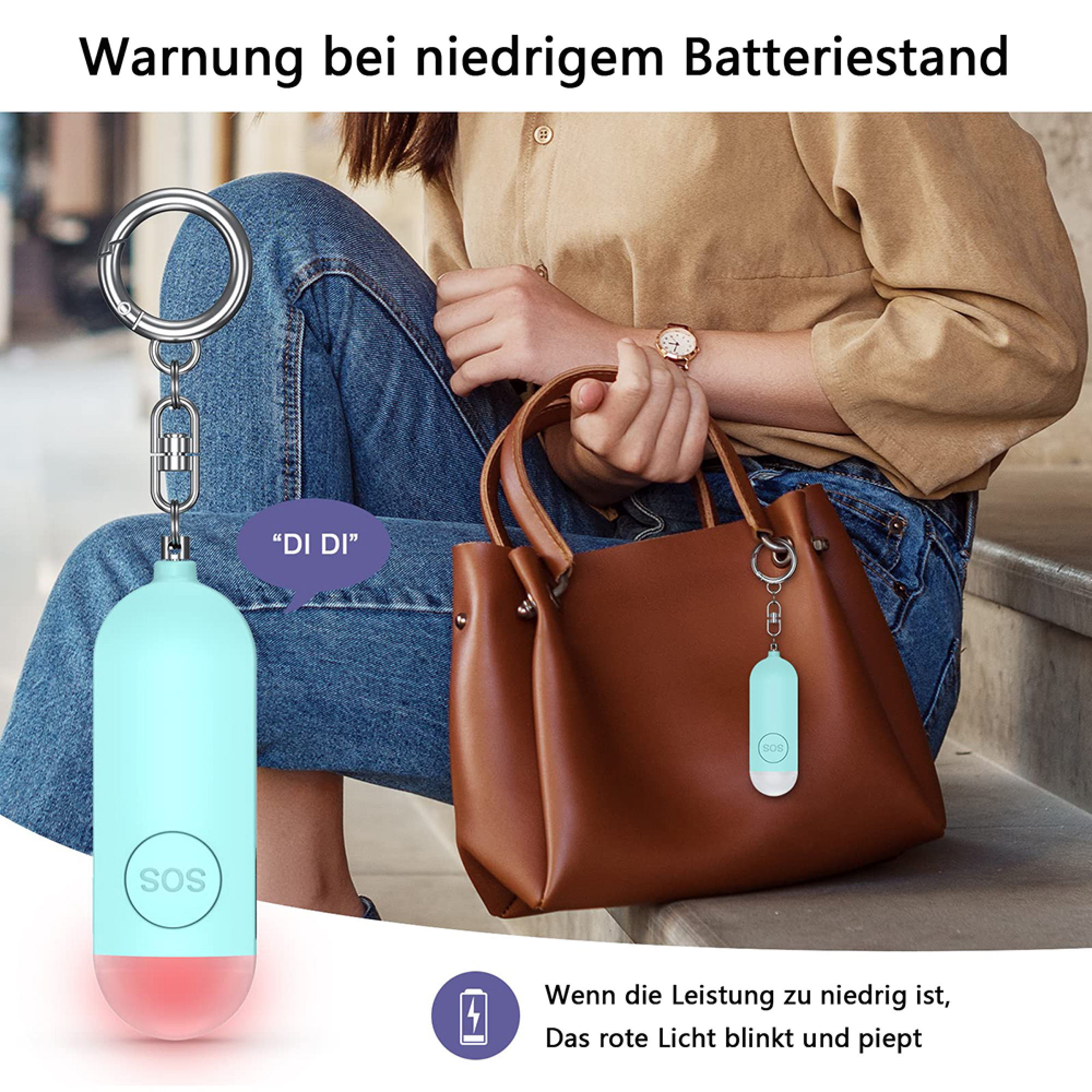 Ein hellblauer SOS-Anhänger mit rotem Licht blinkt. Warnung bei niedrigem Batteriestand.