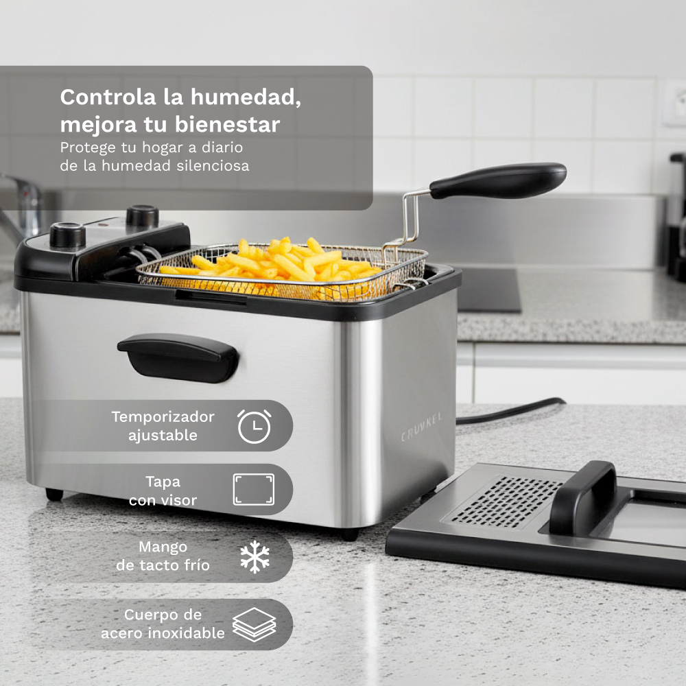Freidora de acero inoxidable con cesta llena de patatas fritas. Incluye temporizador, visor.