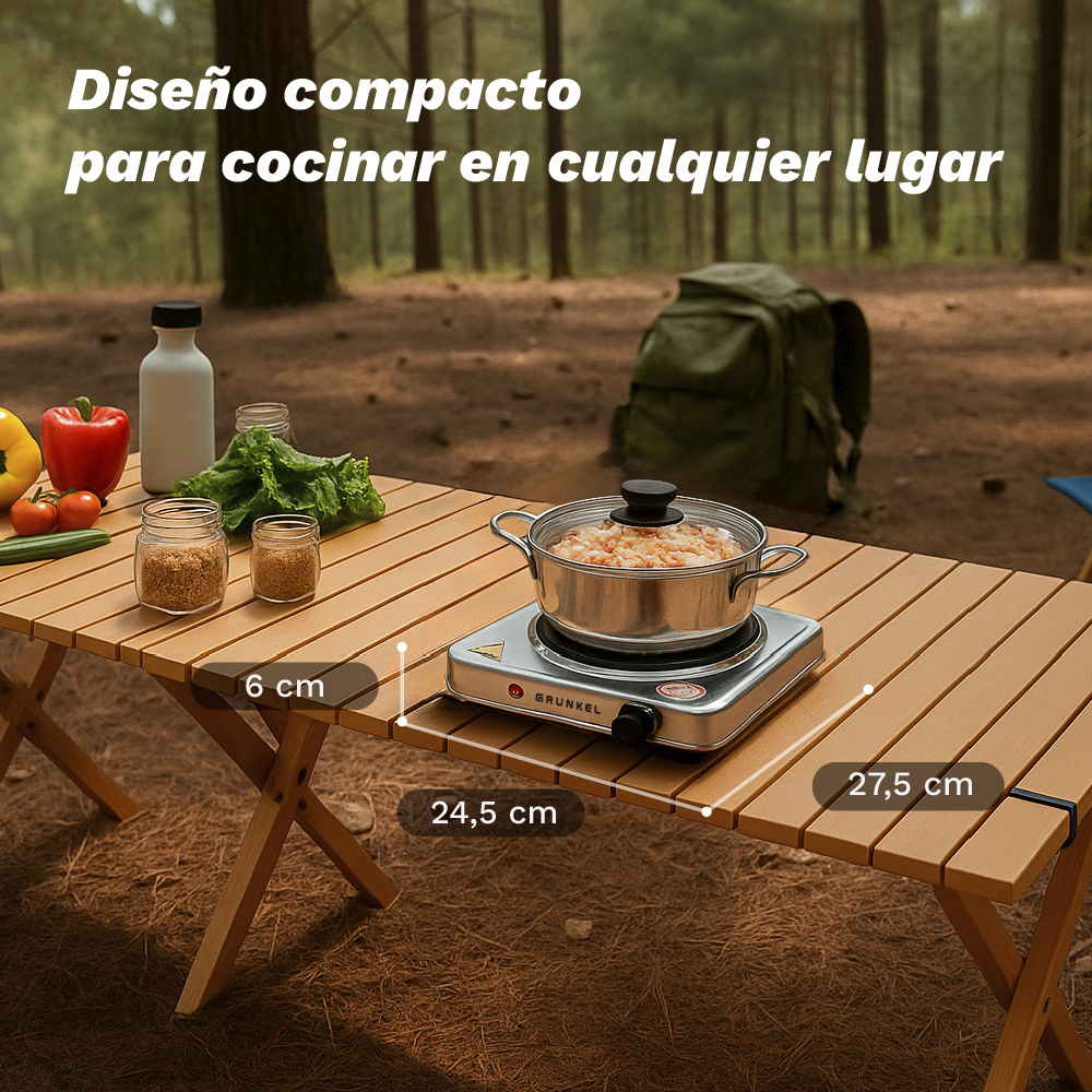 Un fogón portátil y ingredientes sobre una mesa de madera en el bosque.