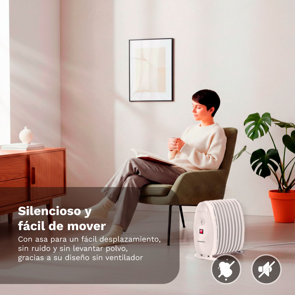 Mujer lee libro en sillón, junto a calefactor y planta.