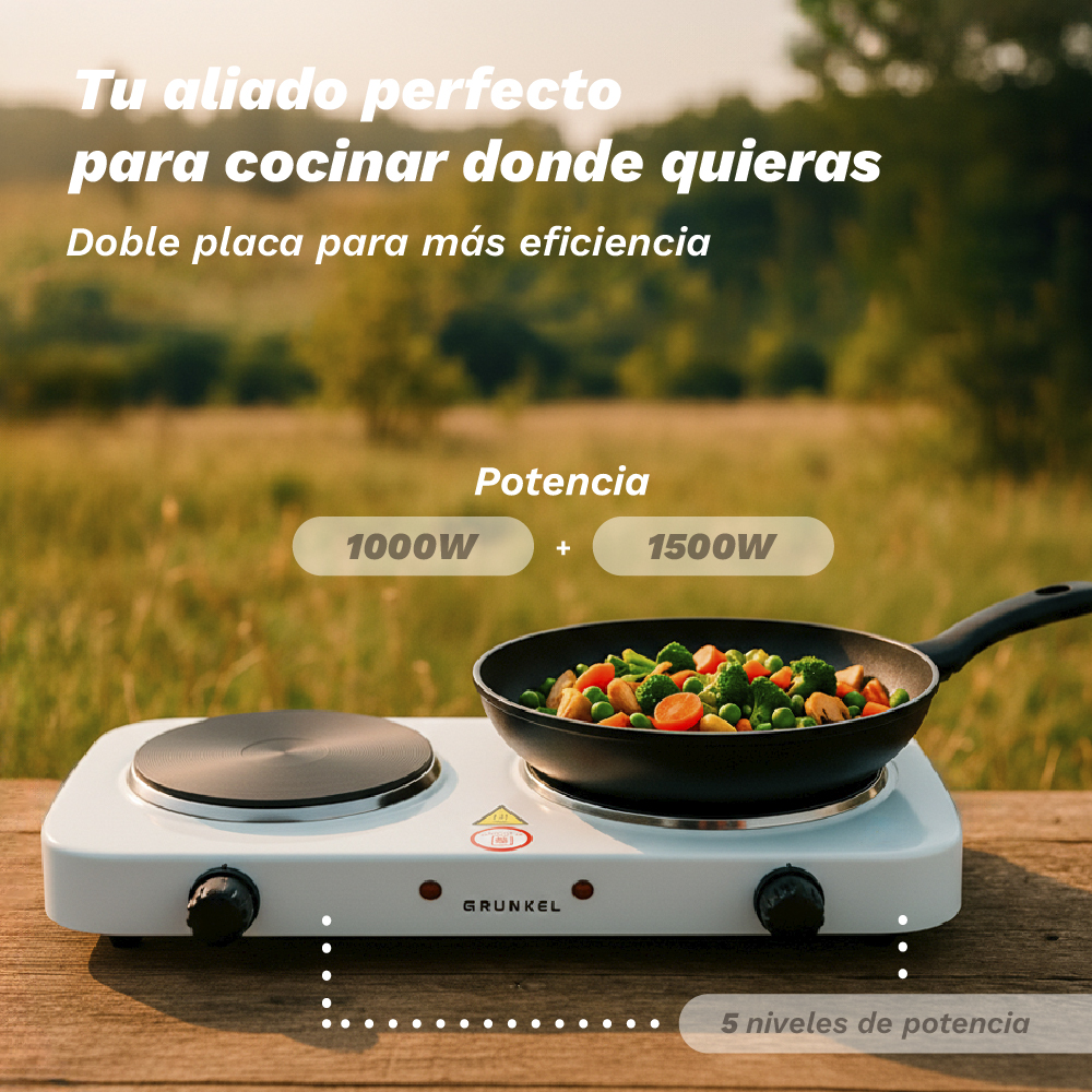 Una placa de cocina doble blanca con sartén y verduras. Potencia 1000W + 1500W.