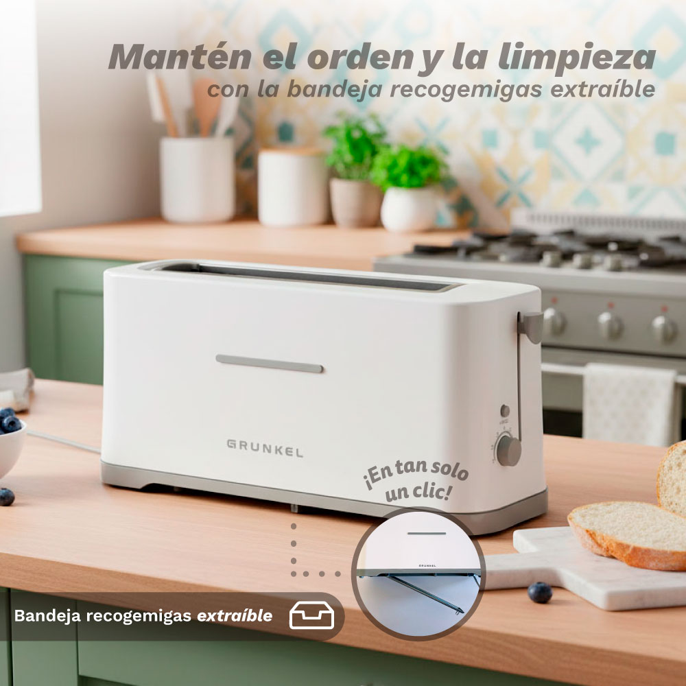 Ein weißer Toaster mit Krümelschublade steht auf einer Küchentheke.