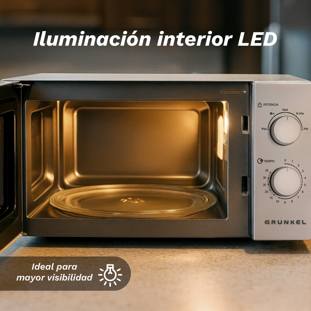 Un microondas abierto con luz interior y perillas de control.