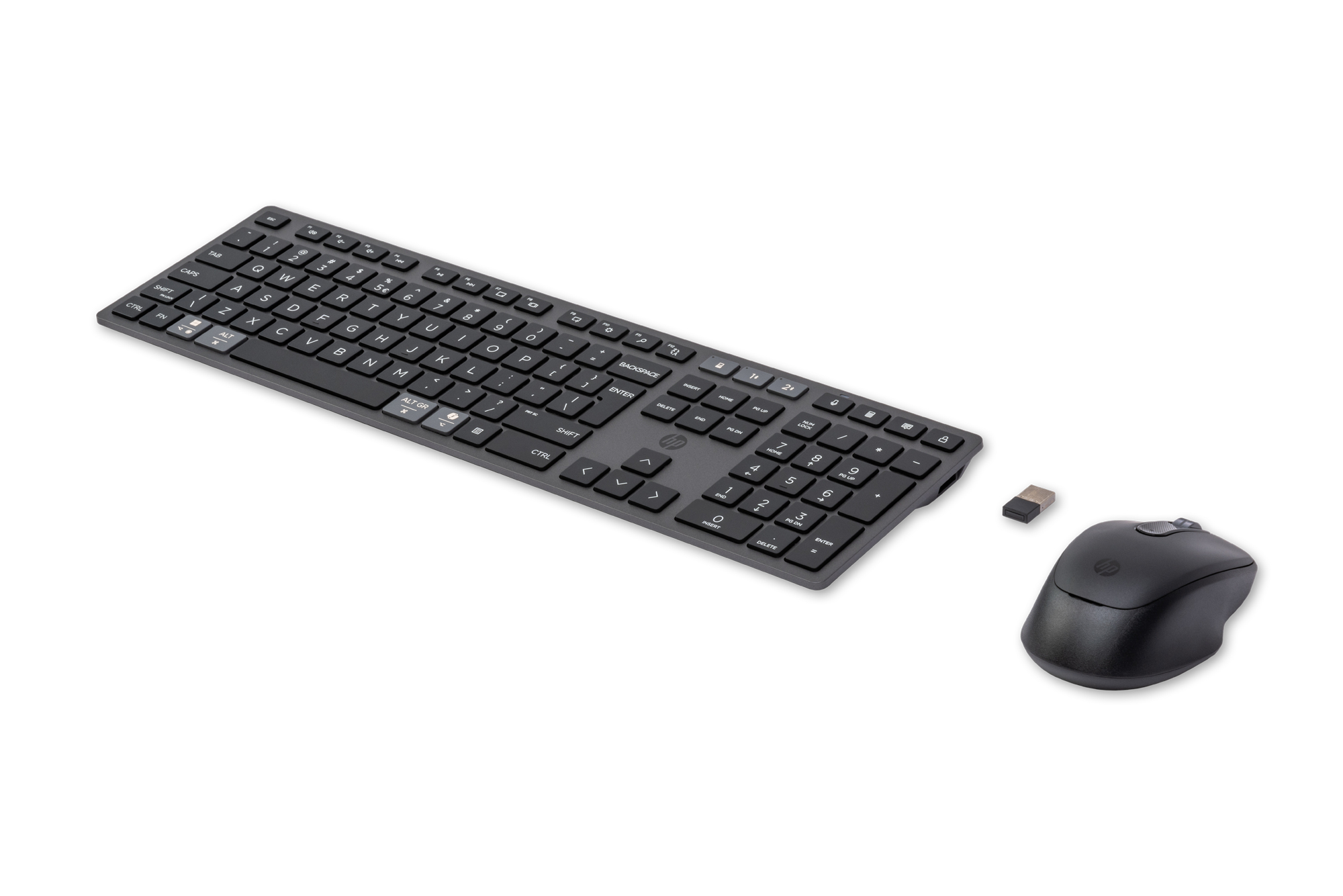 Black keyboard and mouse with USB dongle on a white background.