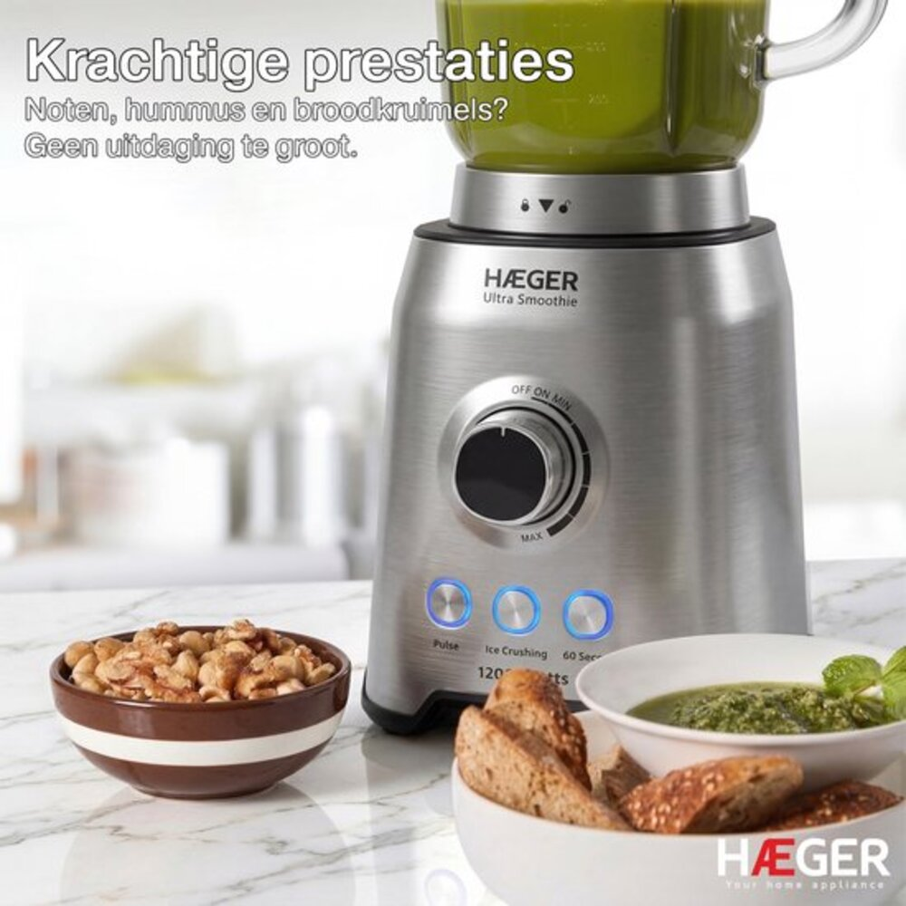 Silver blender with green liquid, nuts, bread, and pesto. Advertisement.