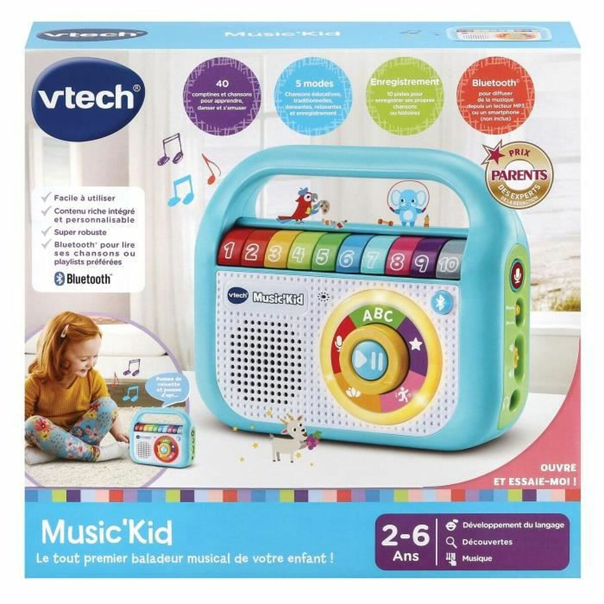 Radio de juguete Vtech Music Kid con teclas, altavoz y asa. El embalaje muestra características.