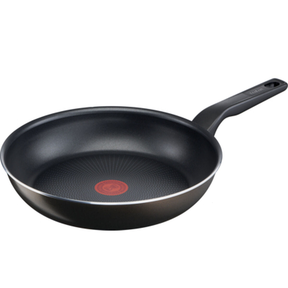 Una padella nera con un Thermospot rosso e un bordo argentato.
