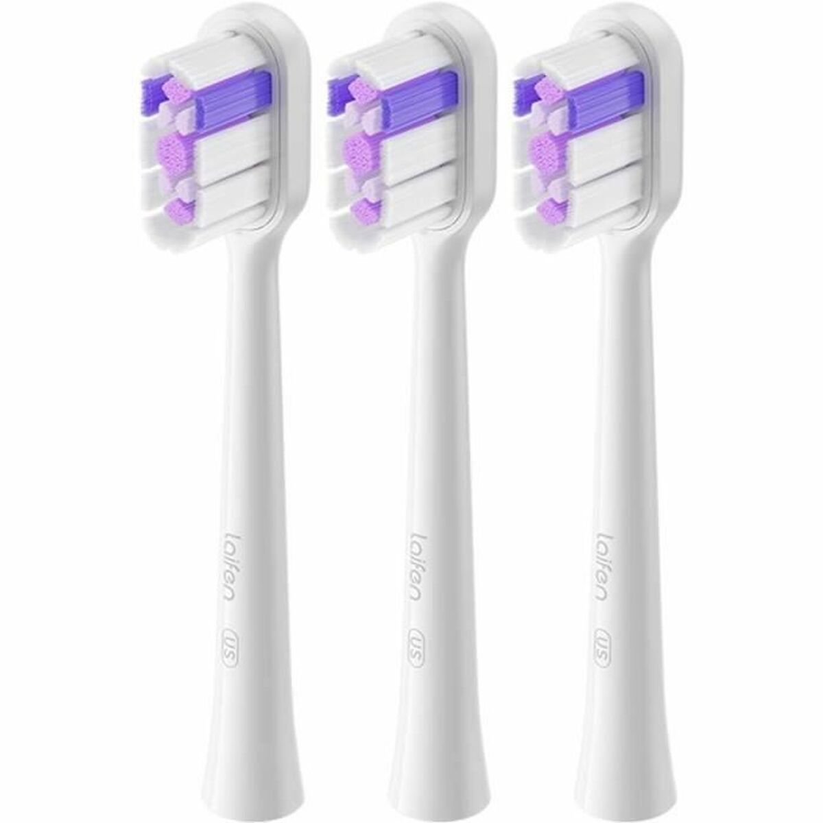 Tre testine di spazzolino bianche con setole viola e bianche una accanto all'altra.