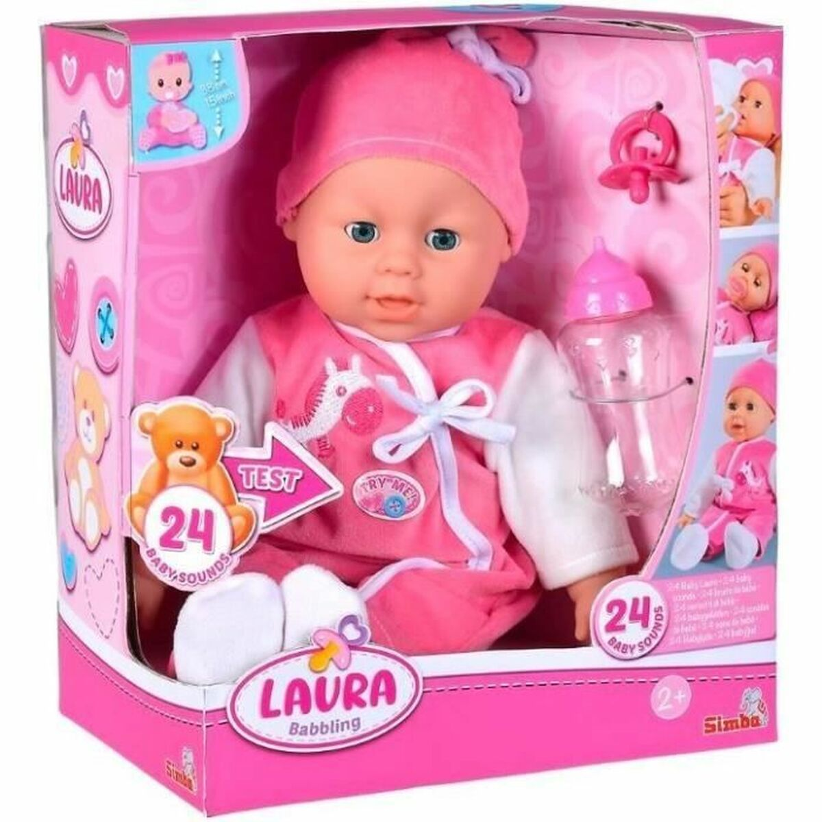 Eine rosa Babypuppe namens Laura in ihrer Verpackung, mit Flasche und Schnuller.