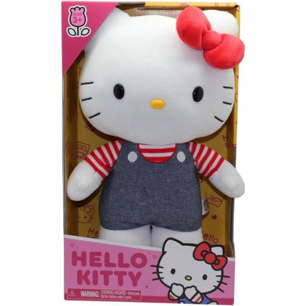 Ein Hello Kitty Plüschtier mit roter Schleife und Latzhose in der Verpackung.