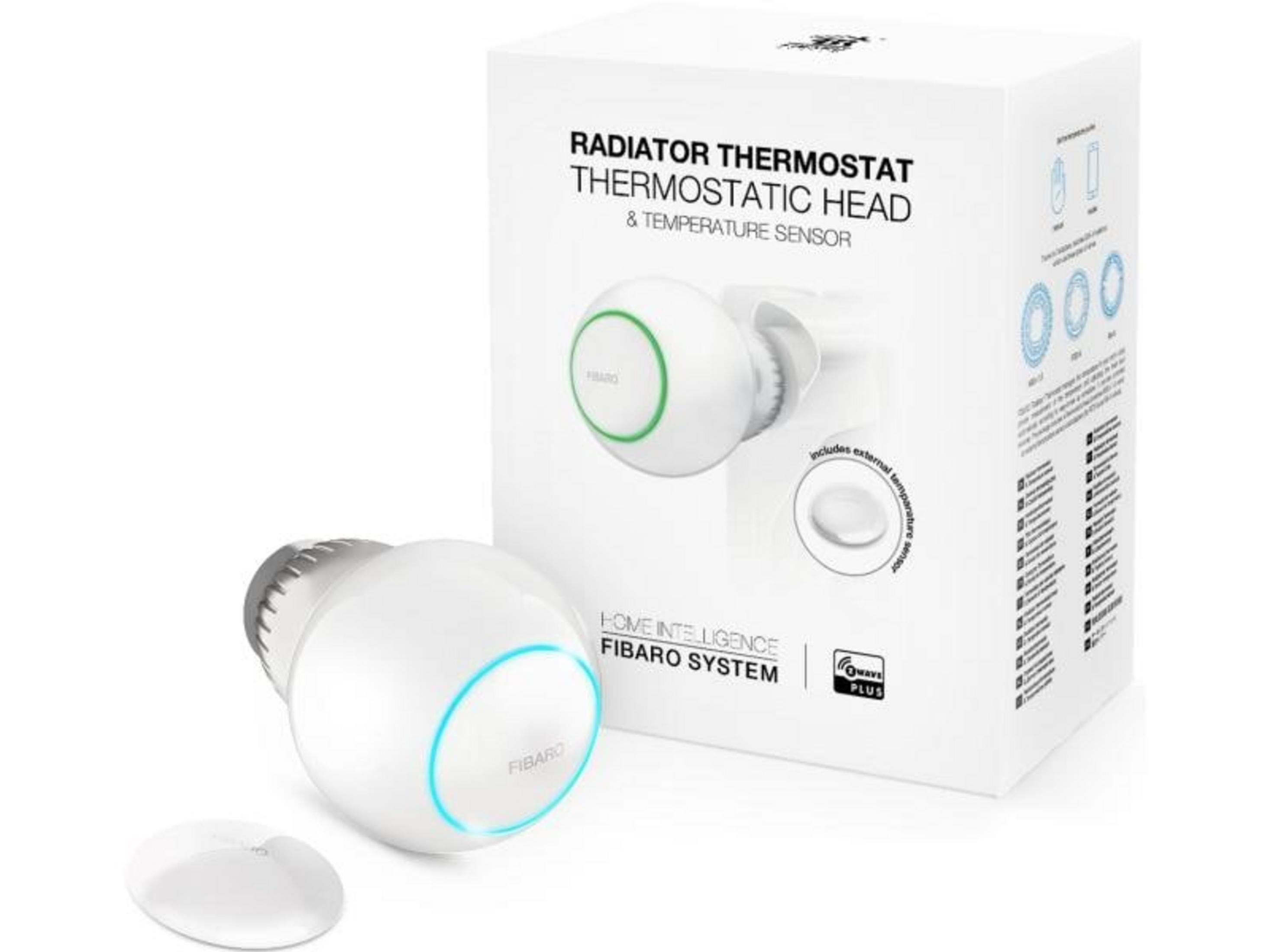 Un termostato de radiador blanco con anillo azul y un sensor junto a su embalaje.